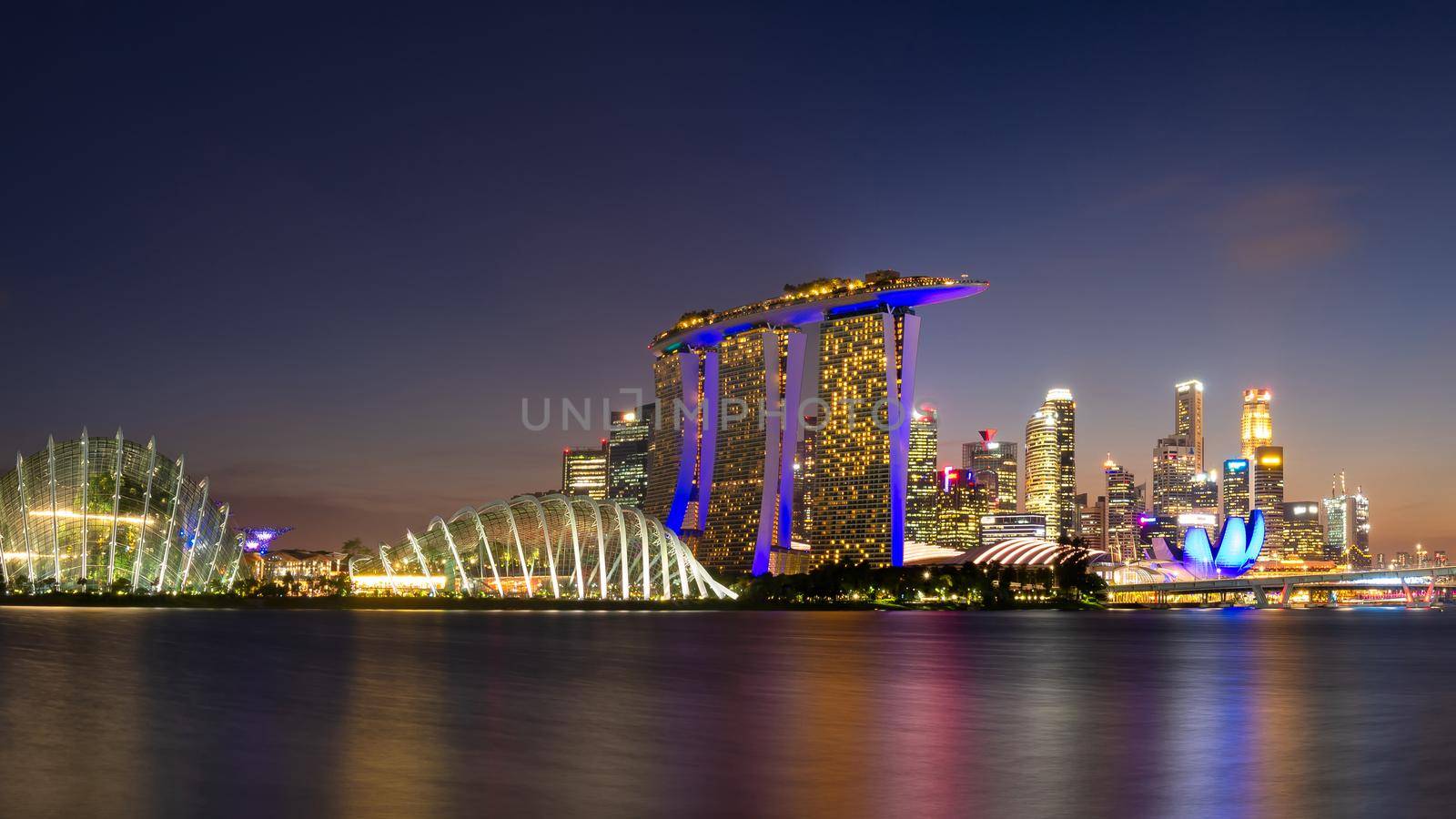 Panorama view of business downtown building area during twilight time at Singapore. by Nuamfolio