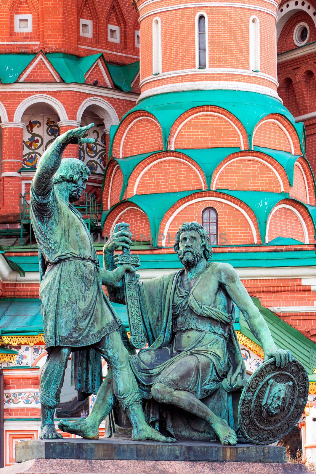 The bronze statue in front of Saint Basil Cathedral at Red Square during sunrise in Moscow at Russia