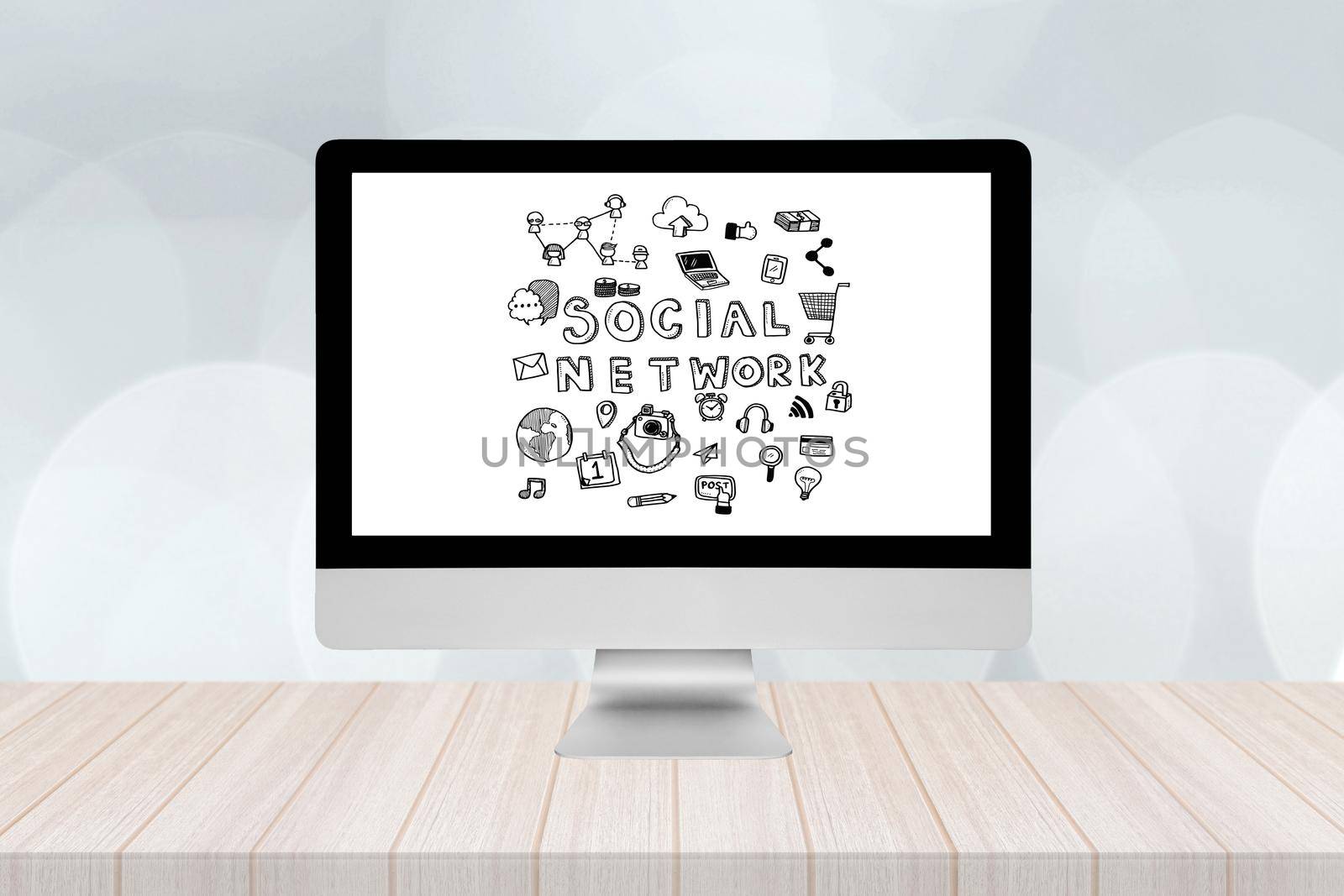 Smart modern pc with social network doodle on screen on wooden table and modern bokeh wall in background. by Nuamfolio