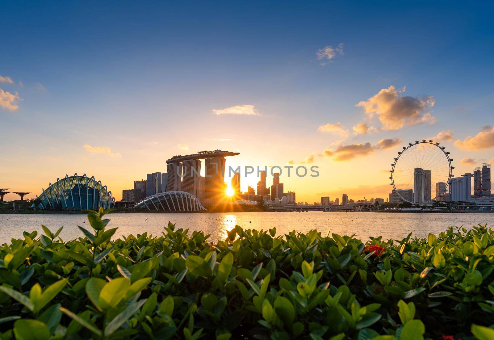 Urban downtown business buildings area at sunset in Singapore.Singapore is a world famous tourist city. by Nuamfolio