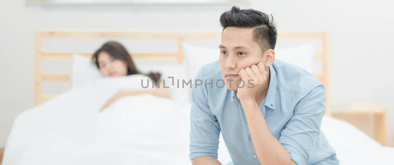 Young asian couple having argument and quarrelling with each other by Nuamfolio