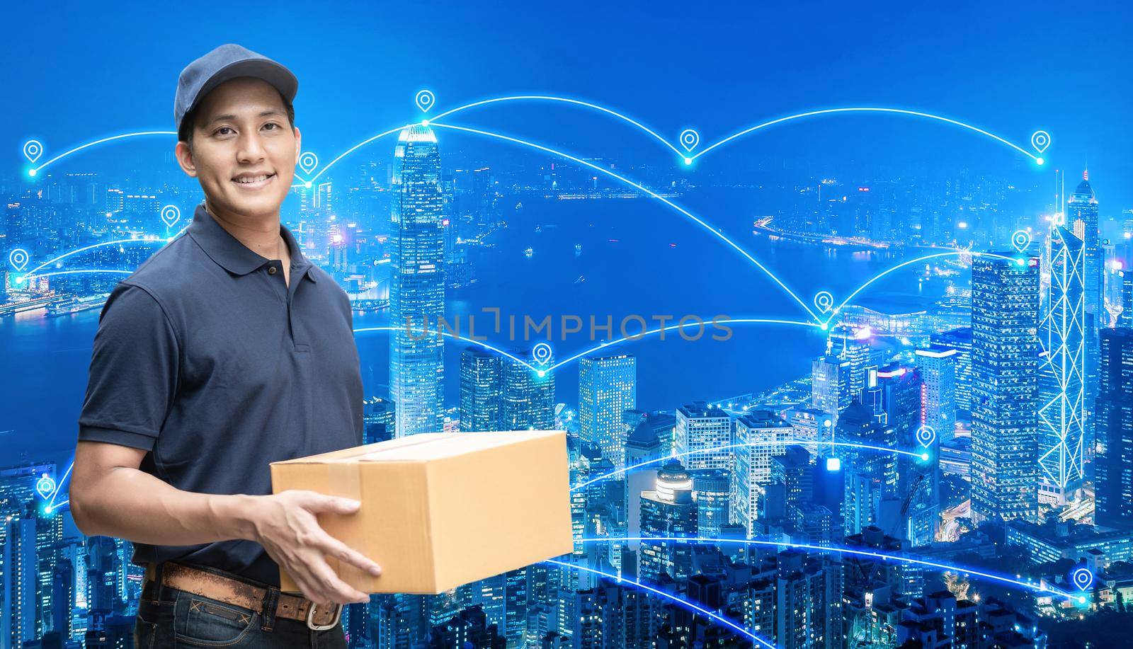 Asian delivery man holding a cardboard box with networking of internet of things in smart city for e-commerce and logistics concept. by Nuamfolio