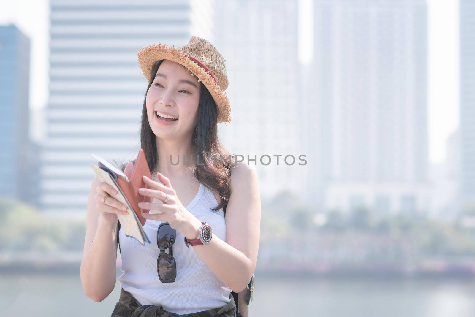 Beautiful asian  tourist woman smiling and enjoying the vacation travel in summer.