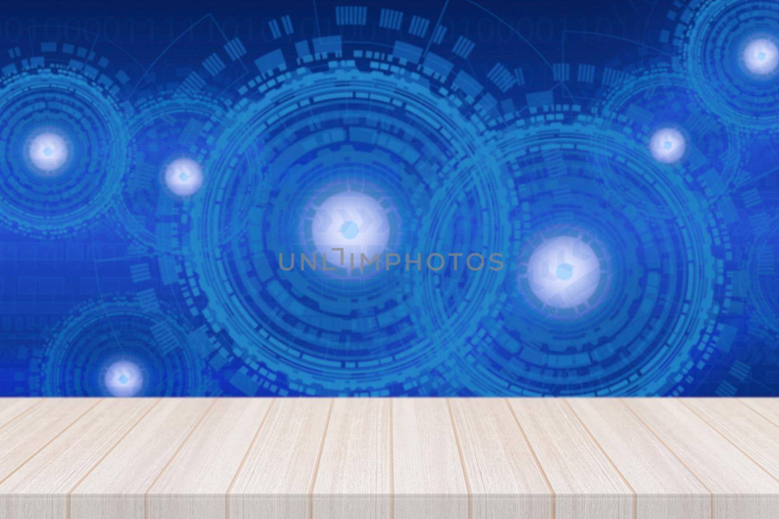 Wood table with futuristic technology background by Nuamfolio