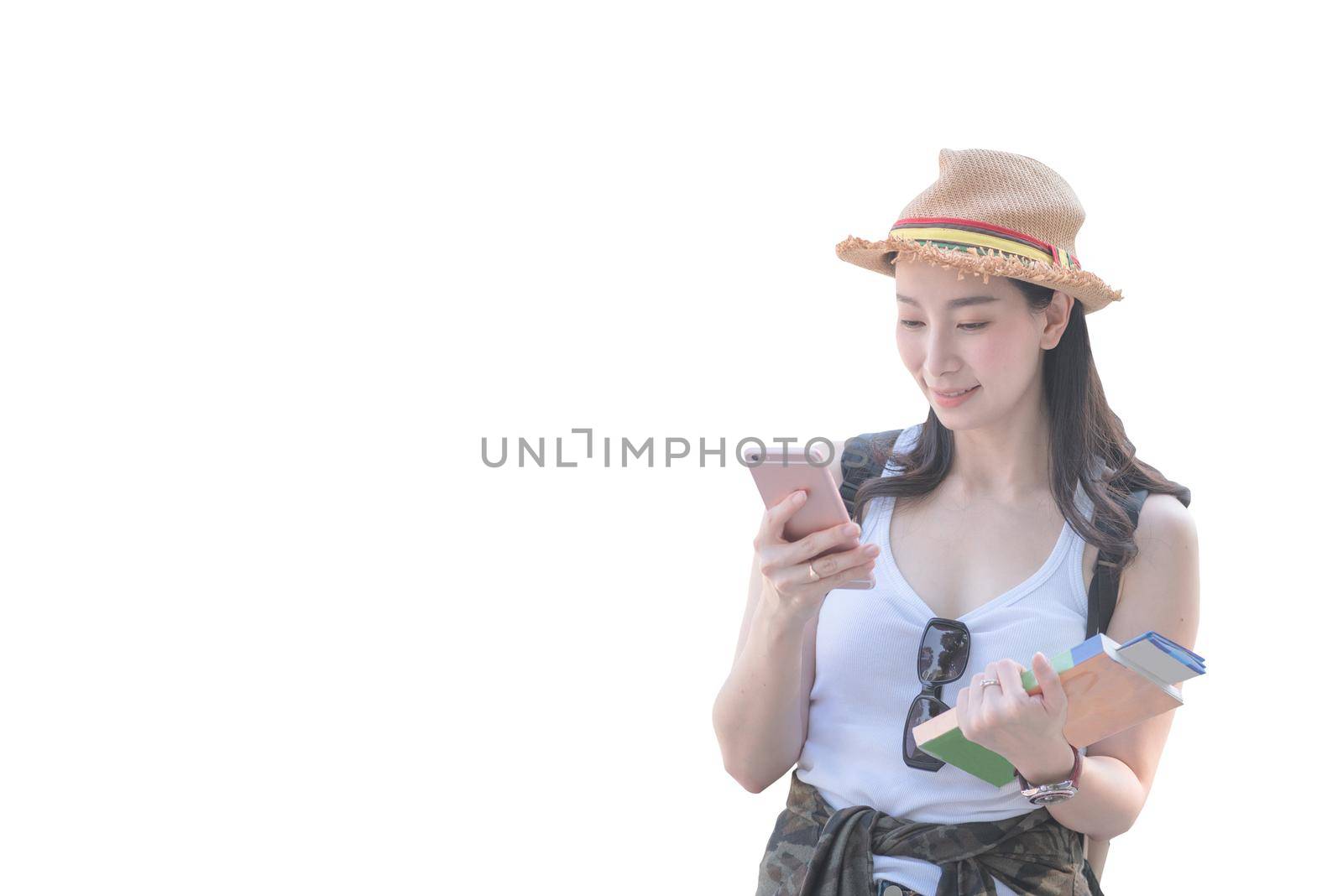 Beautiful asian tourist woman smiling and using mobile phone isolated with clipping path on white background by Nuamfolio