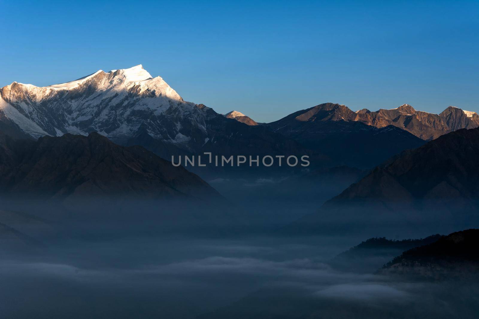 Nature view of Himalayan mountain range at Poon hill view point,Nepal. Poon hill is the famous view point in Gorepani village to see beautiful sunrise over Annapurna mountain range in Nepal
 by Nuamfolio