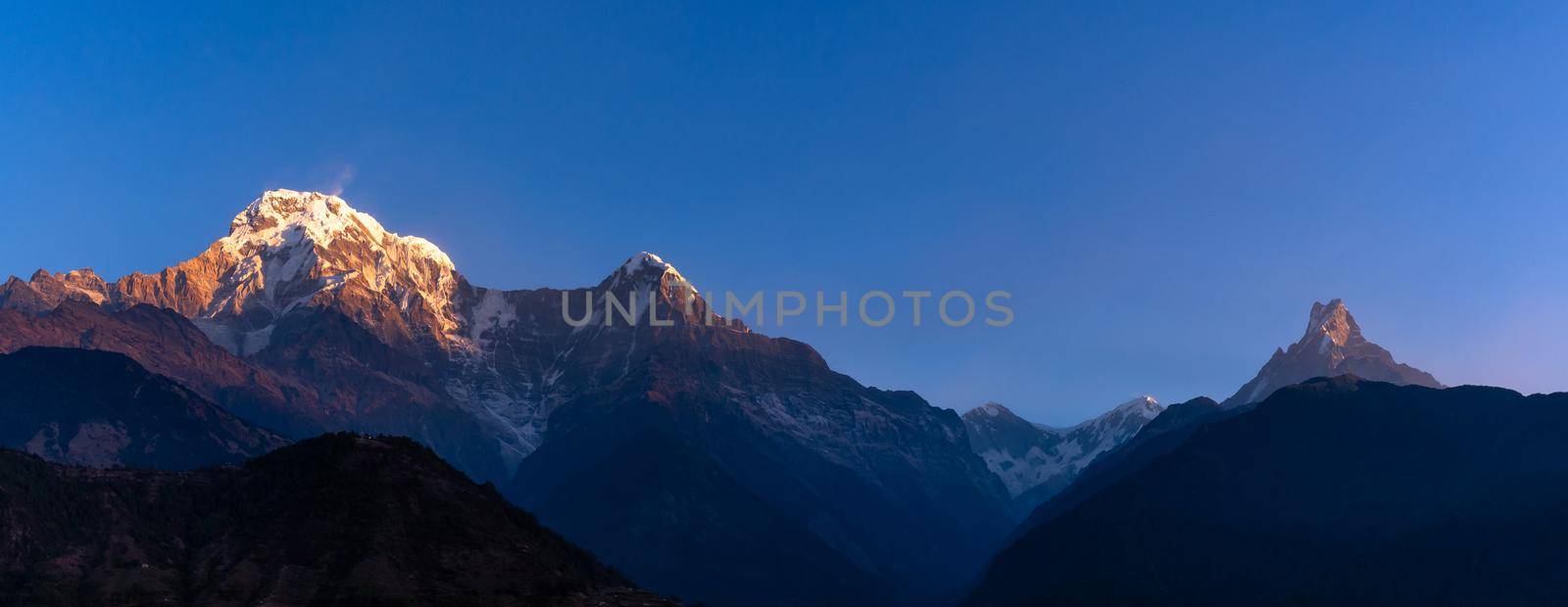 Panorama nature view of Himalayan mountain range with clear blue sky at Nepal by Nuamfolio
