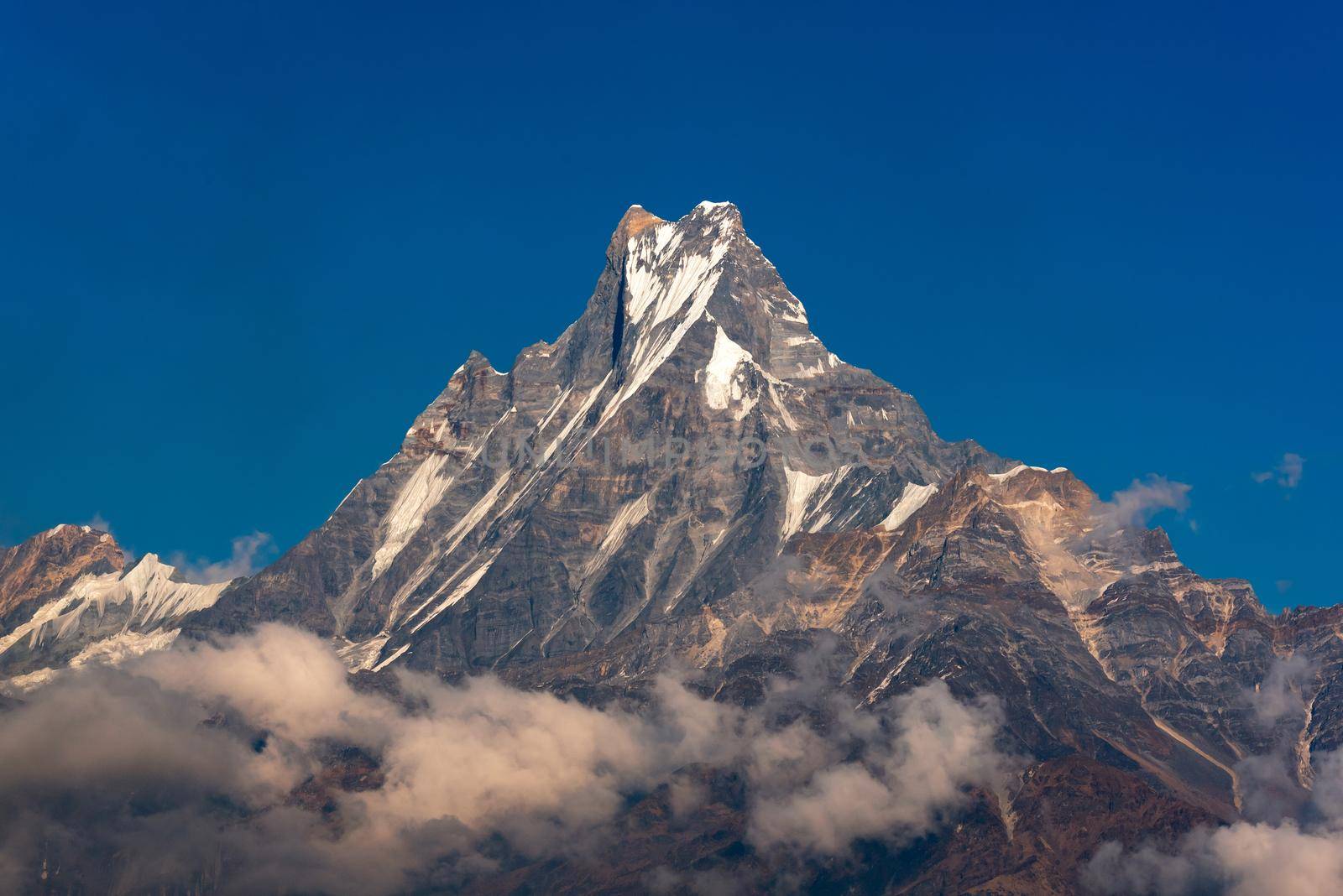 Fishtail peak or Machapuchare mountain with clear blue sky background at Nepal. by Nuamfolio