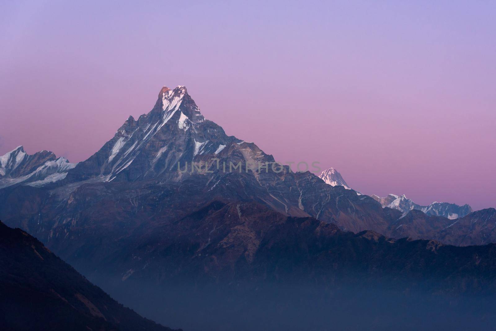 Fishtail peak or Machapuchare mountain  during sunset enviroment at Nepal. by Nuamfolio