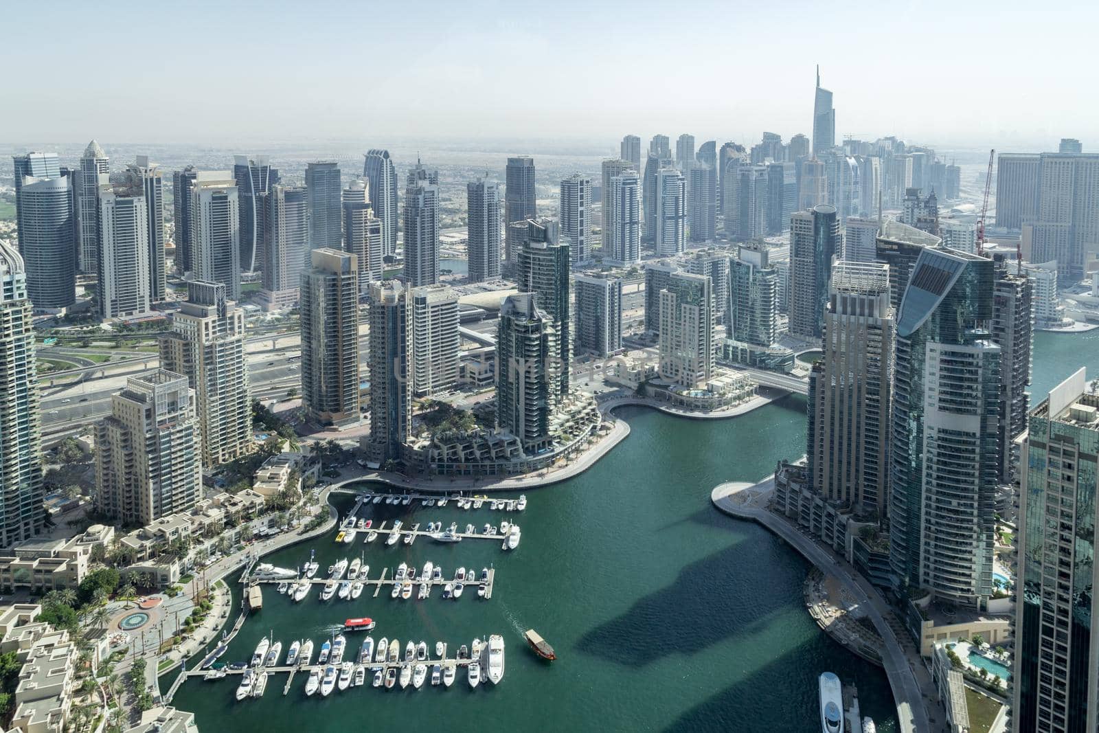 Dubai, United Arab Emirates - October 17, 2014: Elevated view of skyscrapers and yacht harbor in Dubai Marina.