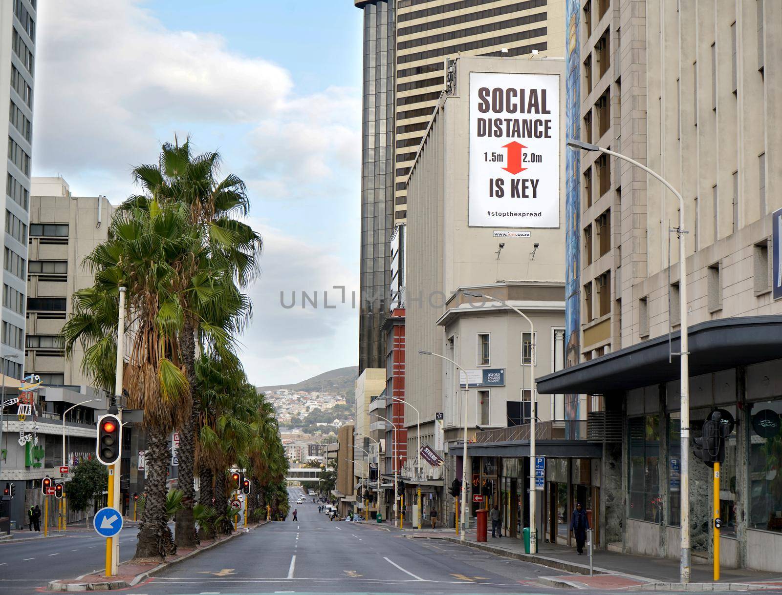 Cape Town, South Africa - 6 April 2020 : Empty streets and a social distancing sign in Cape Town during the Coronavirus lockdown