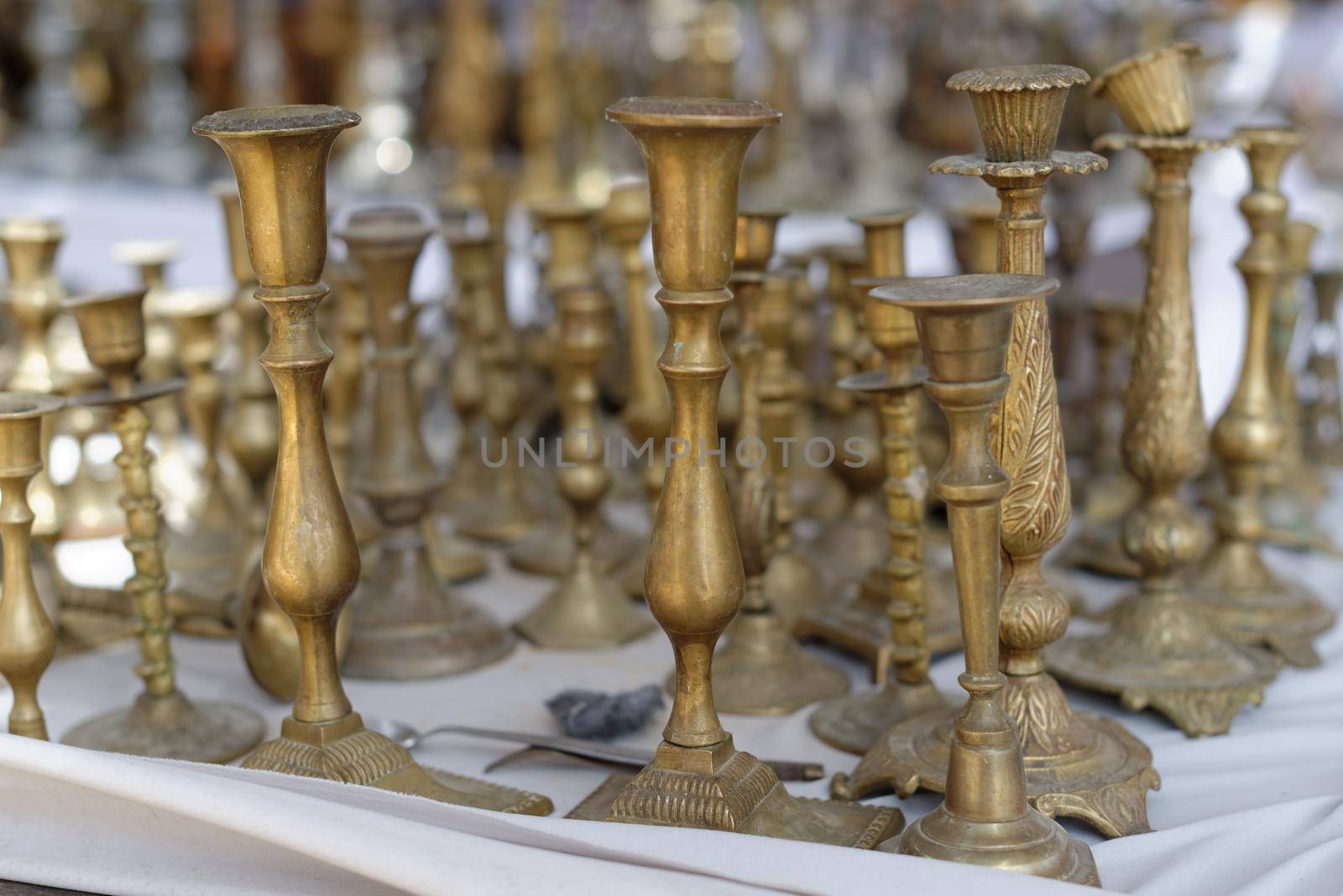Vintage brass candlesticks at a flea market