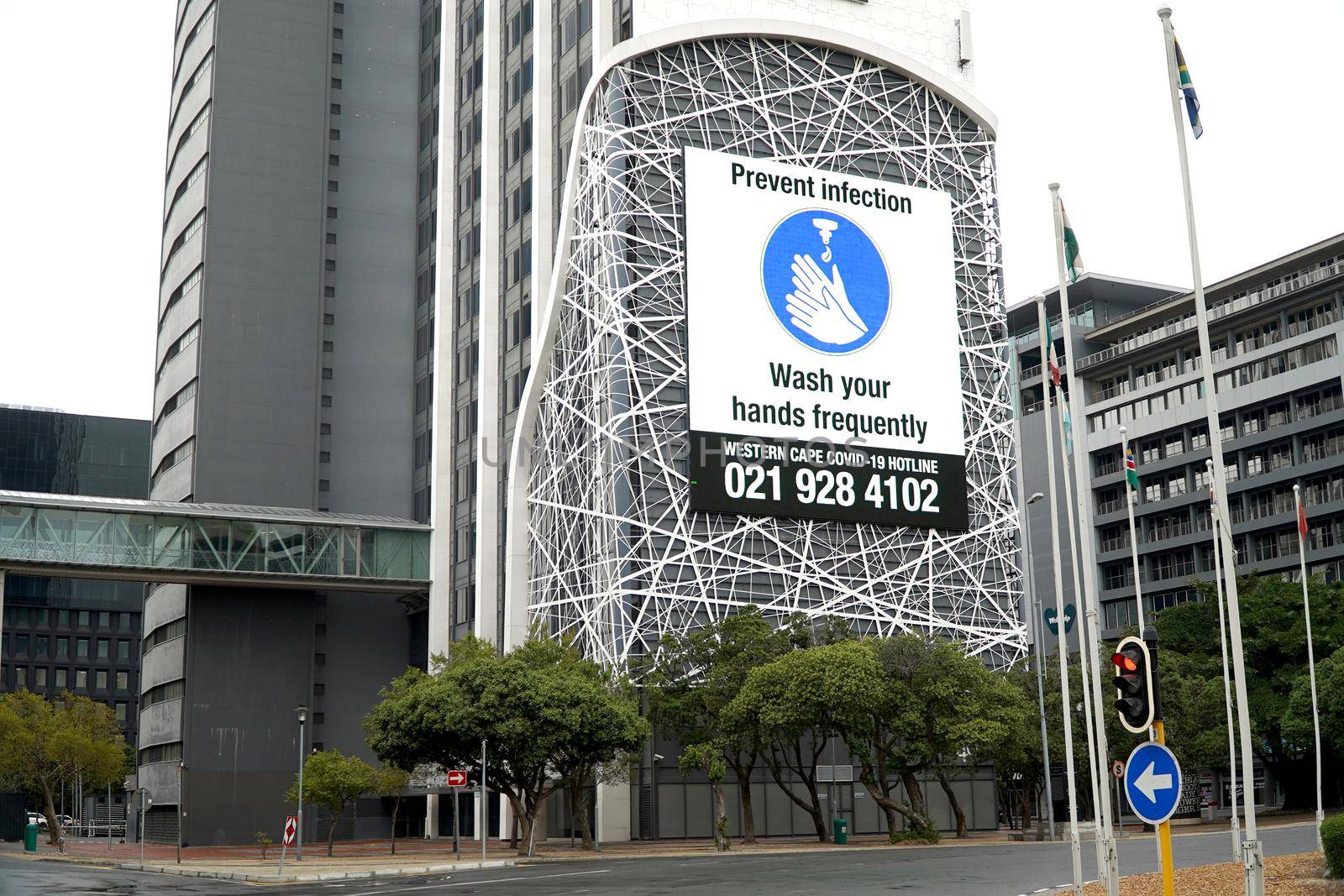 Cape Town, South Africa - 16 April 2020 : Hand washing sign on a buikding on an office building in Cape Town, South Africa