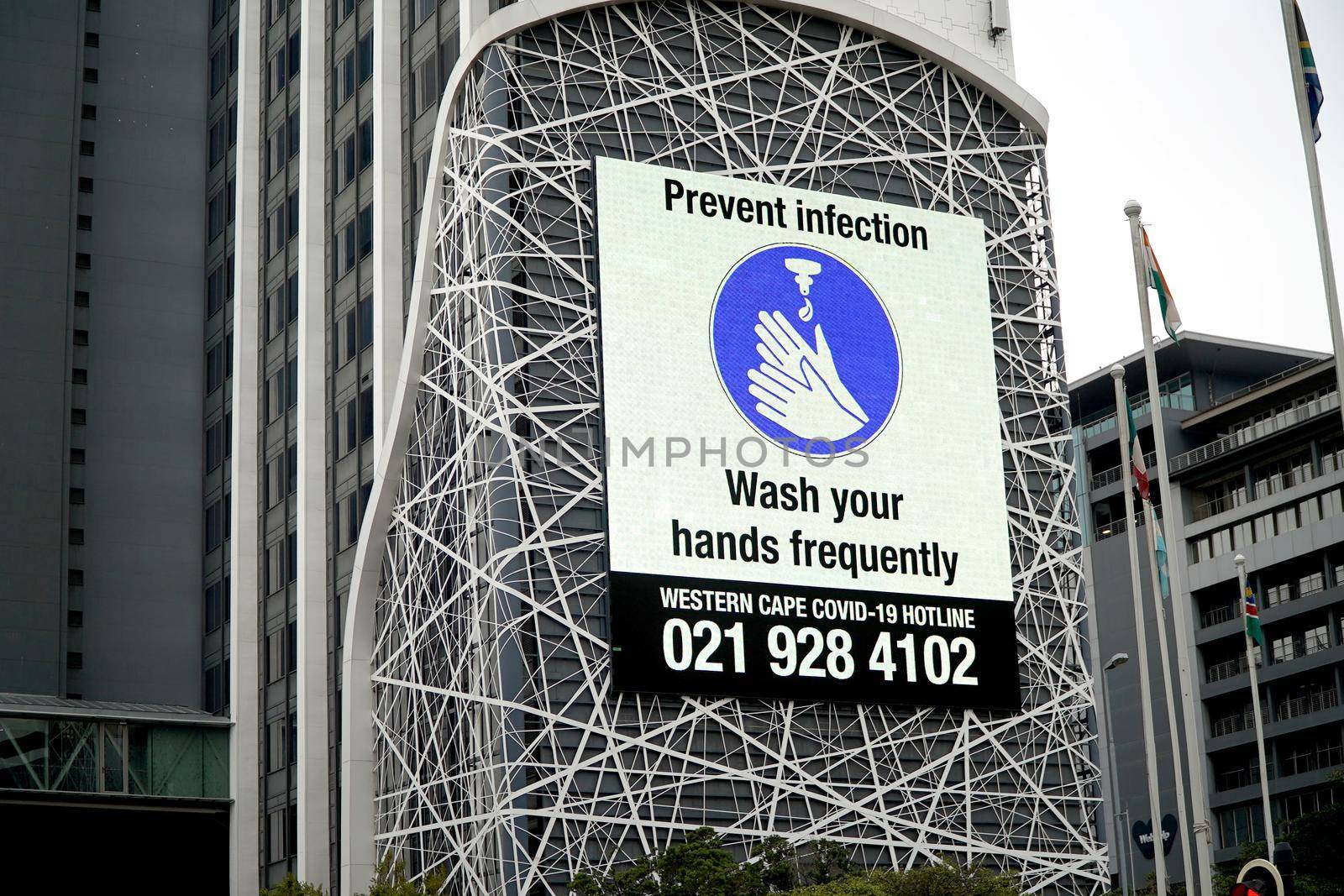 Cape Town, South Africa - 16 April 2020 : Hand washing sign on a buikding on an office building in Cape Town, South Africa by fivepointsix