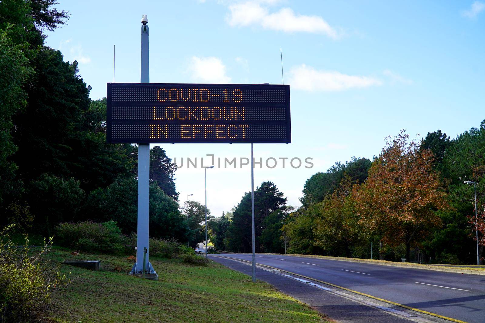 Cape Town, South Africa - 16 April 2020 : Empty streets of Cape town, South Africa during the lock down, with warning sign.