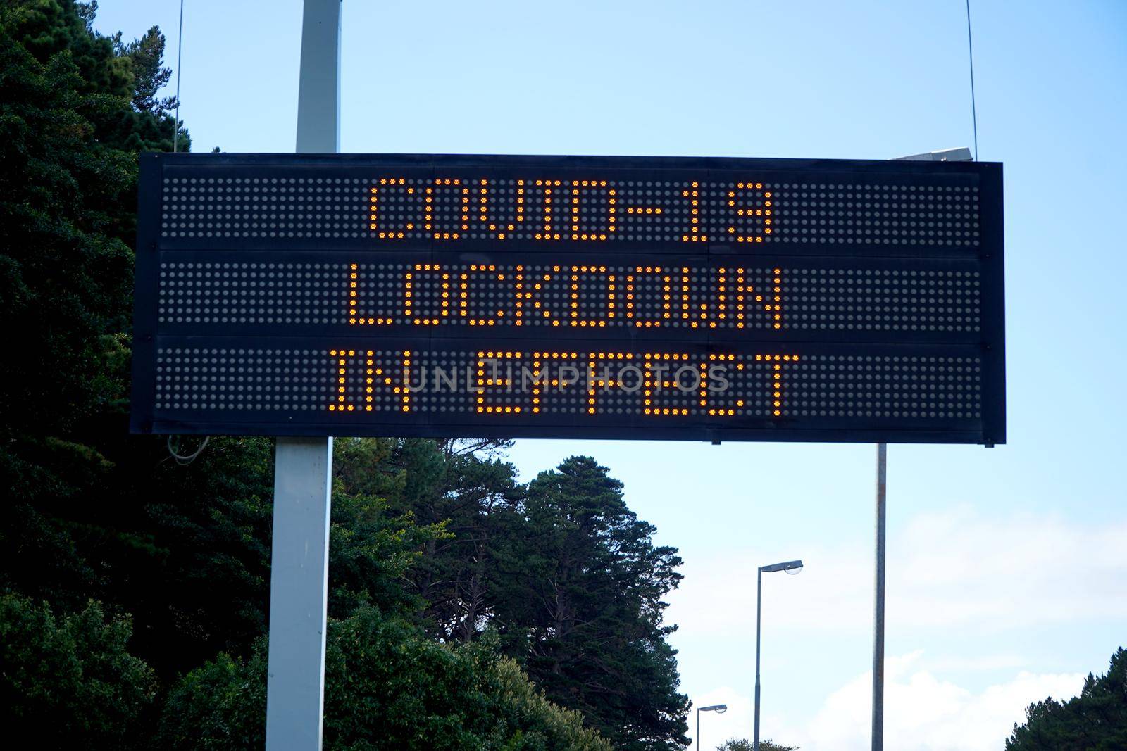 Cape Town, South Africa - 16 April 2020 : Empty streets of Cape town, South Africa during the lock down, with warning sign. by fivepointsix