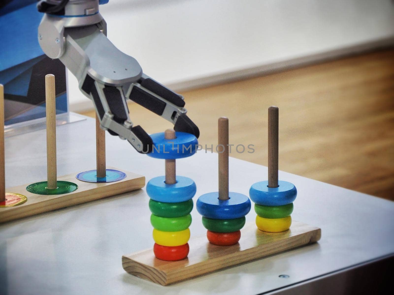 Robotic hand moving an object representing artificial intelligence in industrial environment