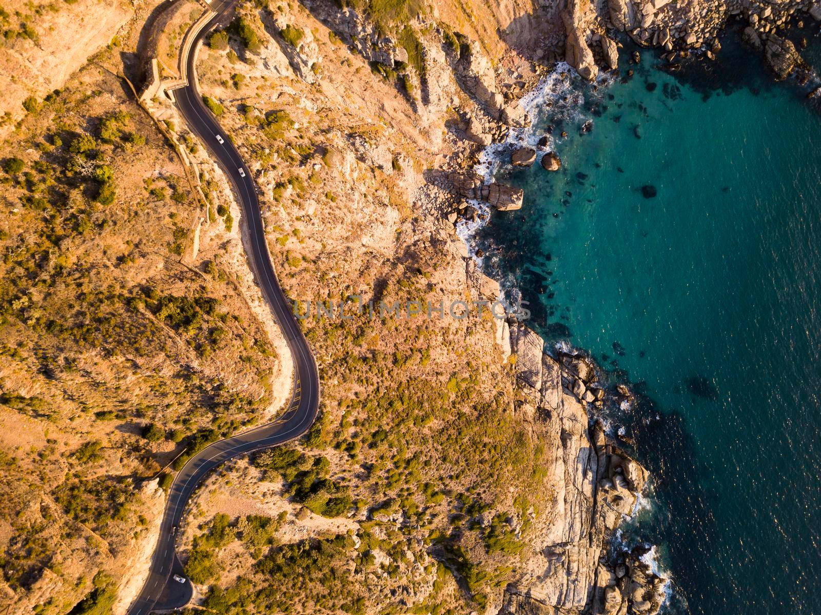 Aerial of winding coastal road by fivepointsix