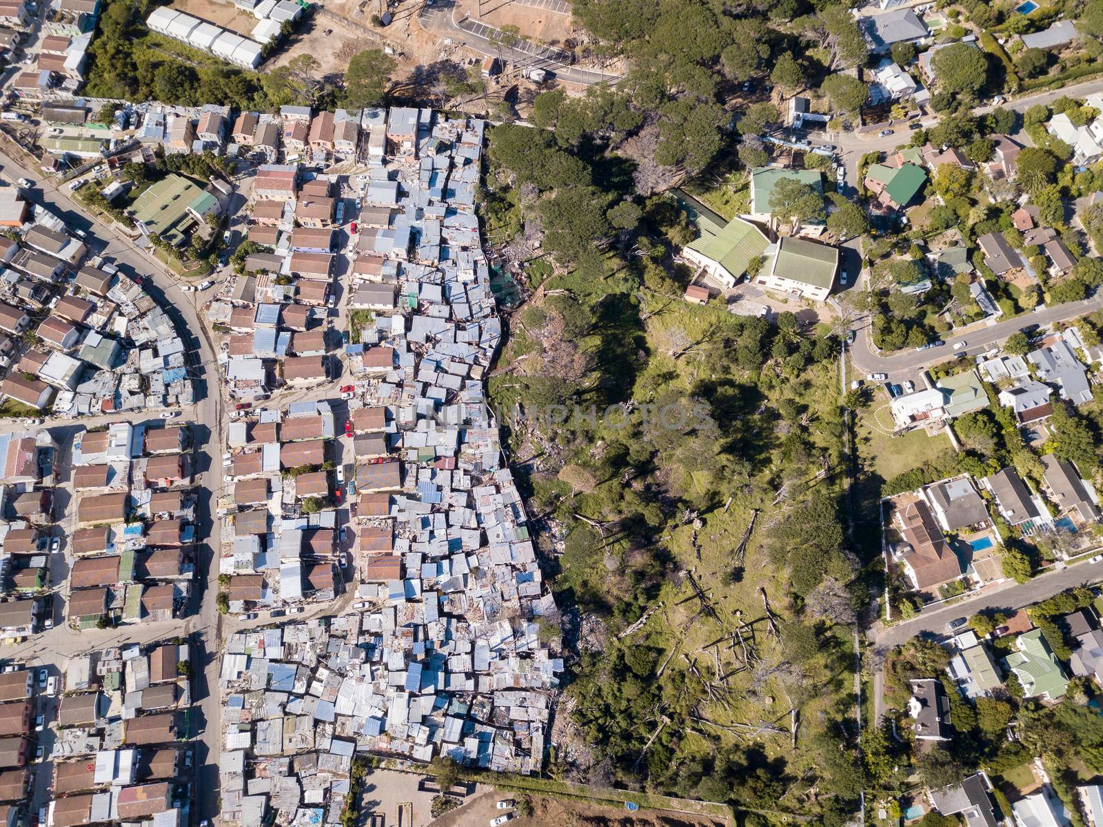 Aerial overhead township and middle class houses in South Africa by fivepointsix