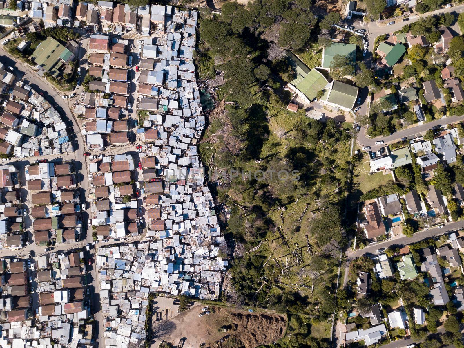 Aerial overhead township and middle class houses in South Africa by fivepointsix