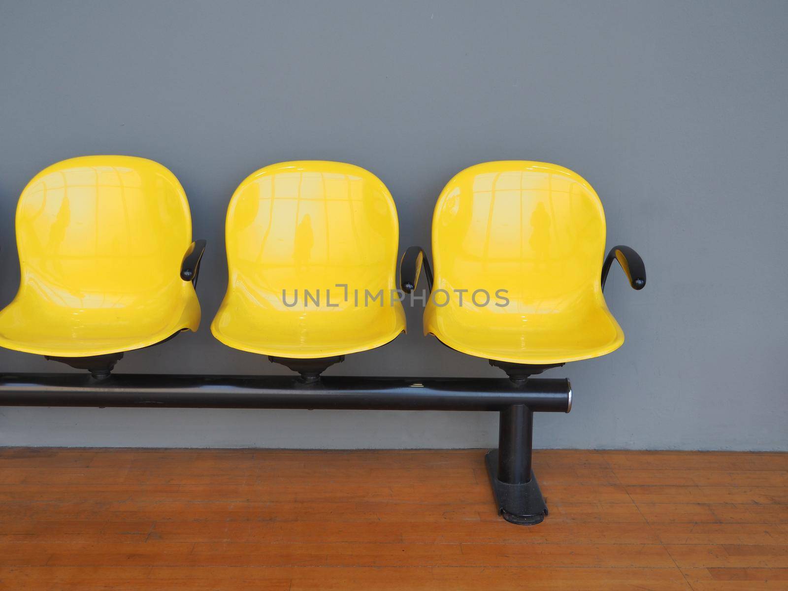 Empty yellow seats in a waiting room