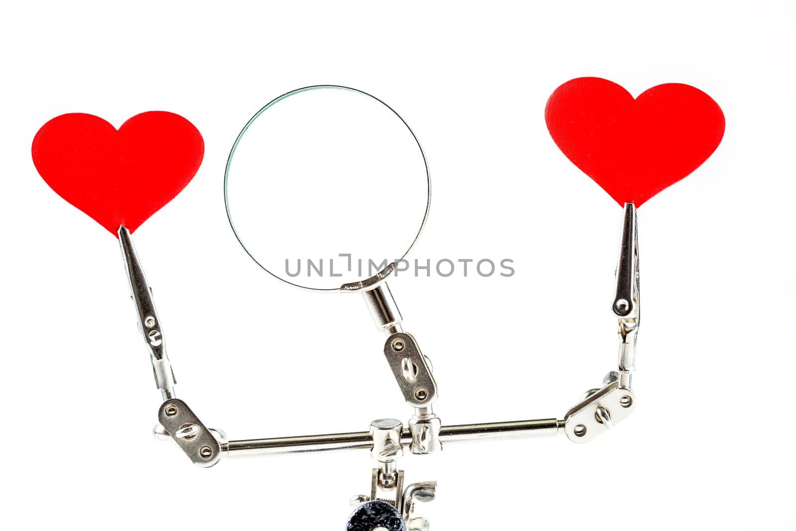 Abstract Valentines Day background with engineering tool third hand holding hearts on white background