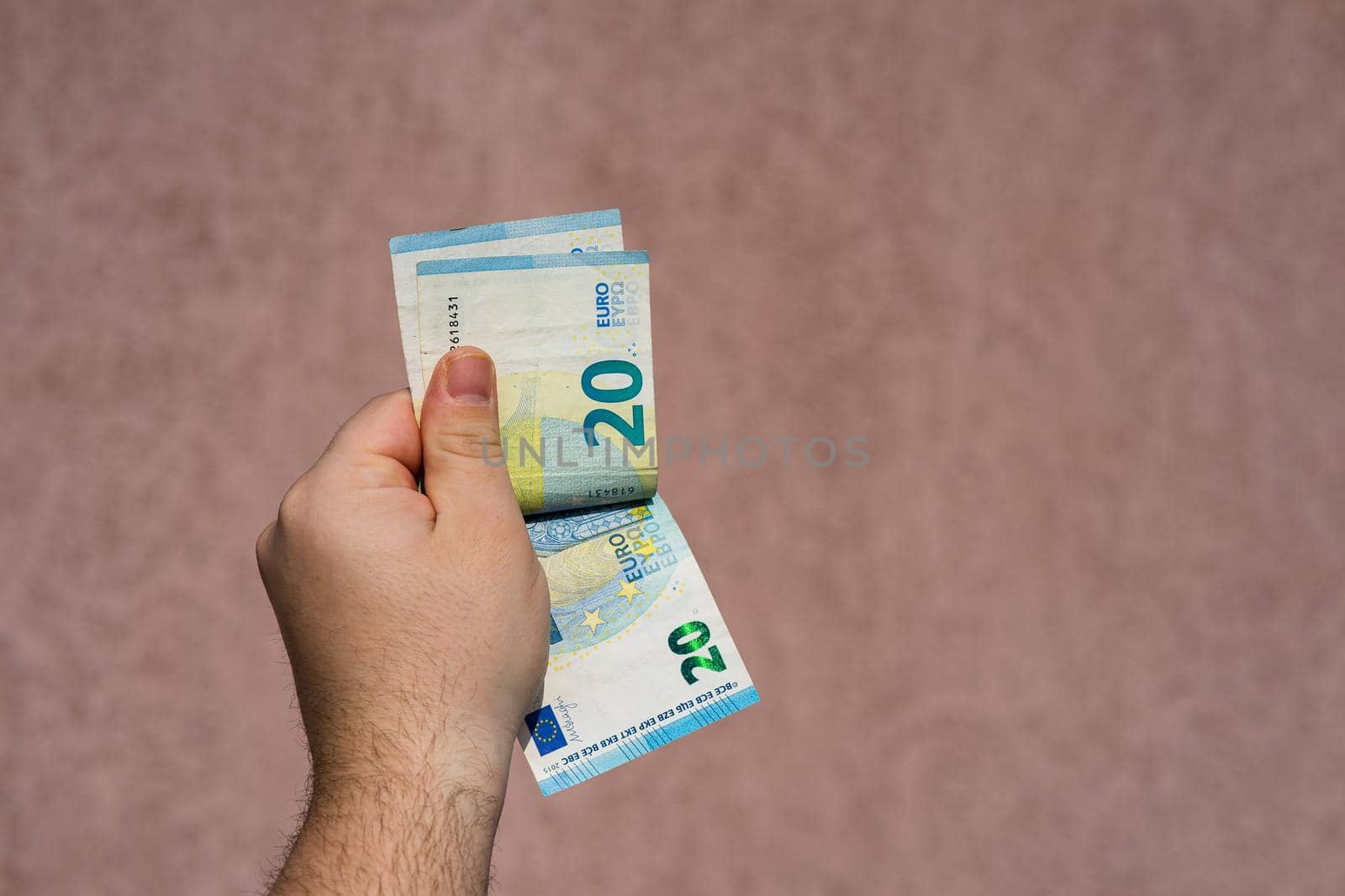 Hand couting holding and showing euro money or giving money. World money concept, 20 EURO banknotes EUR currency isolated with copy space. Concept of rich business people, saving or spending money.