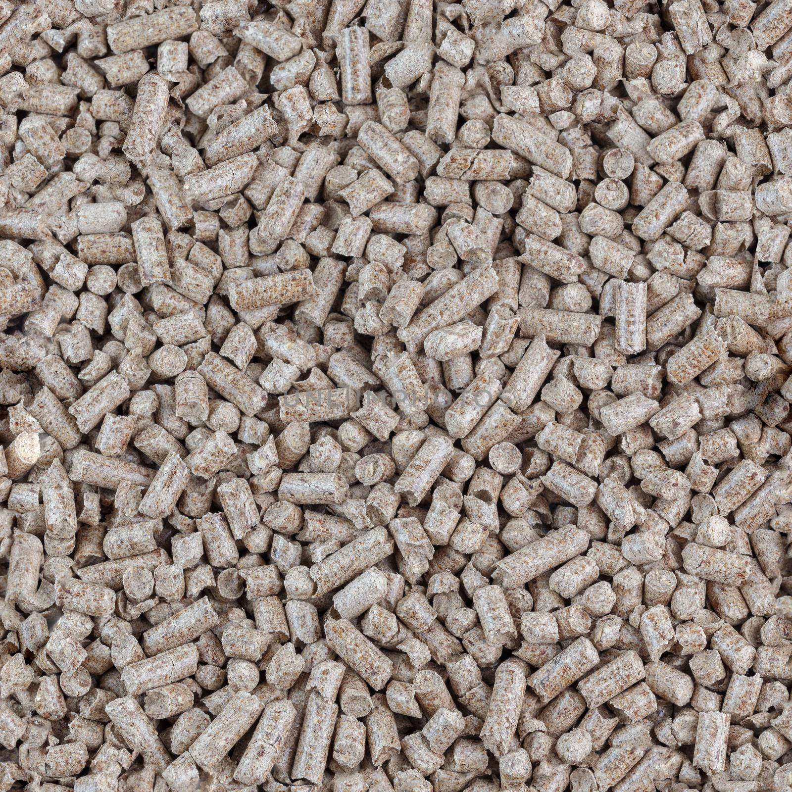 Compressed wooden sawdust pellets seamless texture and background. Alternative biofuel and pet litter, mulch.