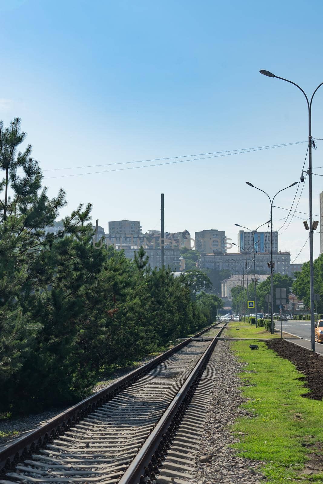 Vladivostok, Russia. City skyline with the railway on the street.