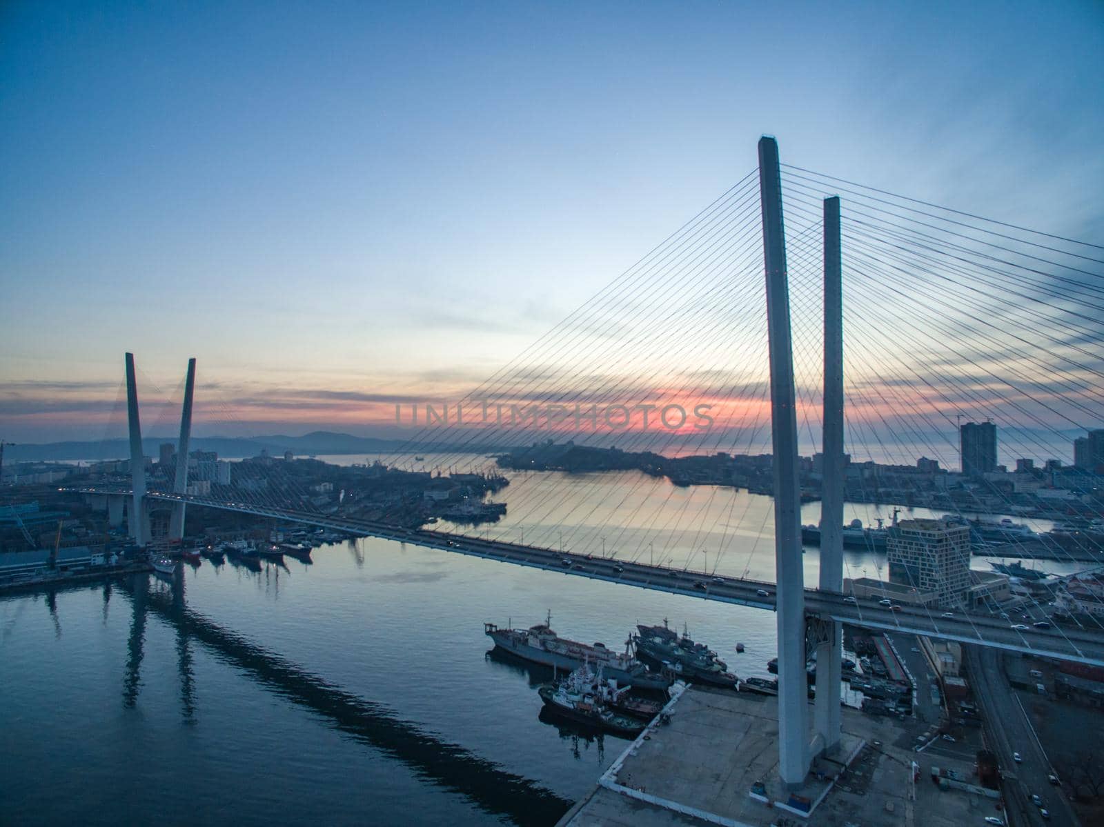 Vladivostok, Russia. Aerial view of the Golden bridge against the evening sunset.