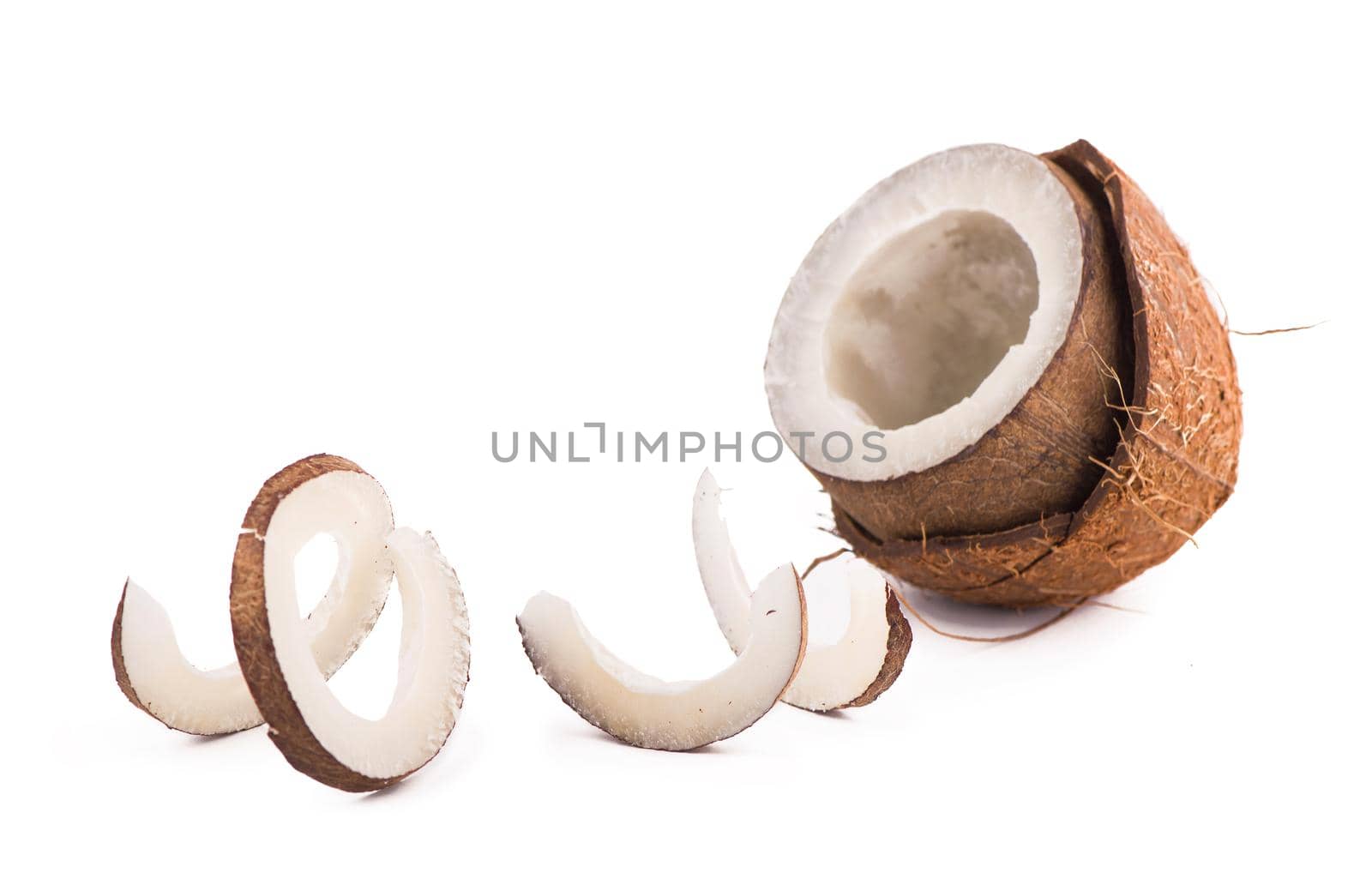 Coconuts with leaves on a white background.