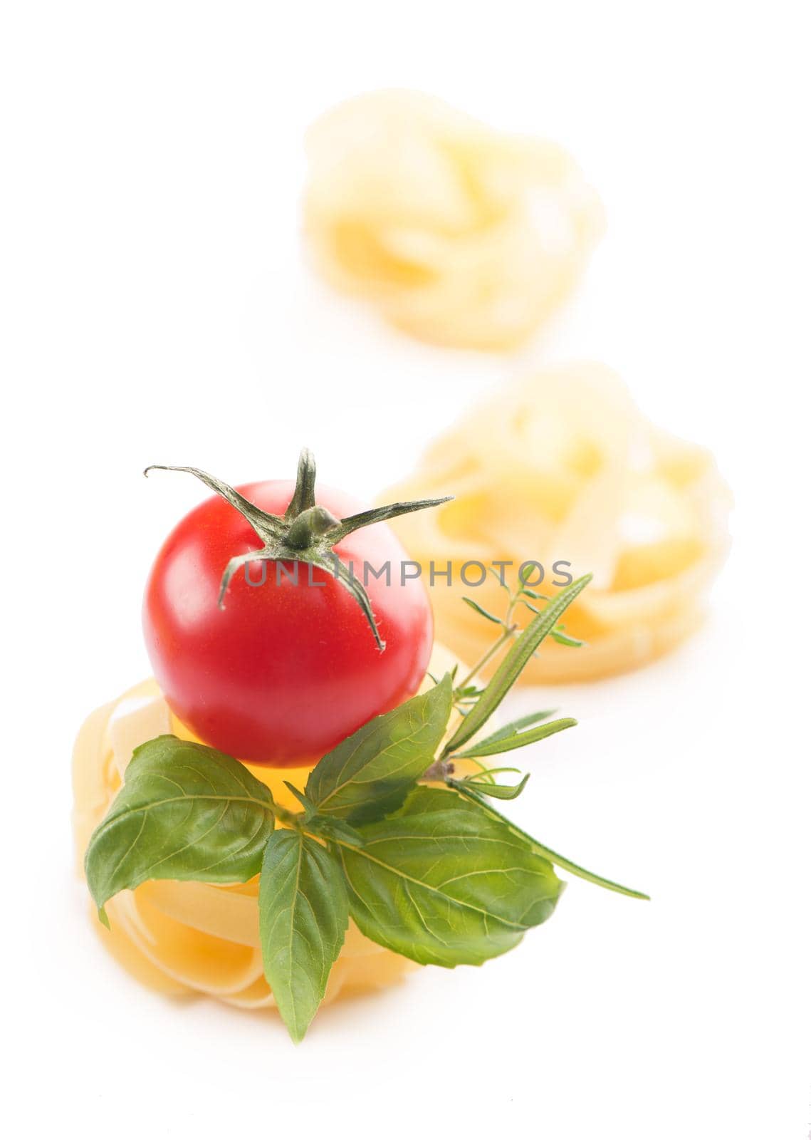 Spaghetti and basil isolated on white background. With clipping path.