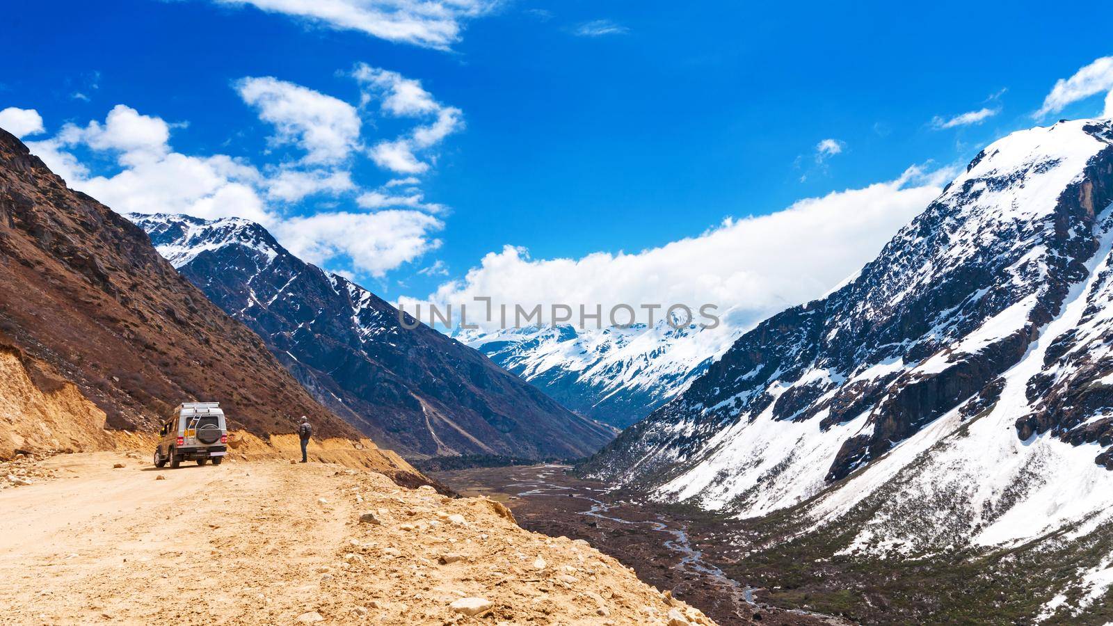 Beautiful landscape of Chopta valley with Snow covered beautiful mountain peaks against the blue sky at north Sikkim India