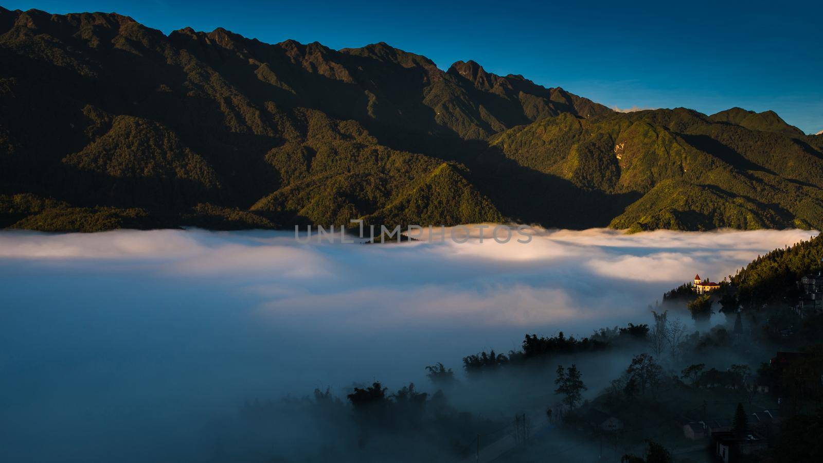 Sapa valley city in the mist in the morning, Vietnam by Nuamfolio