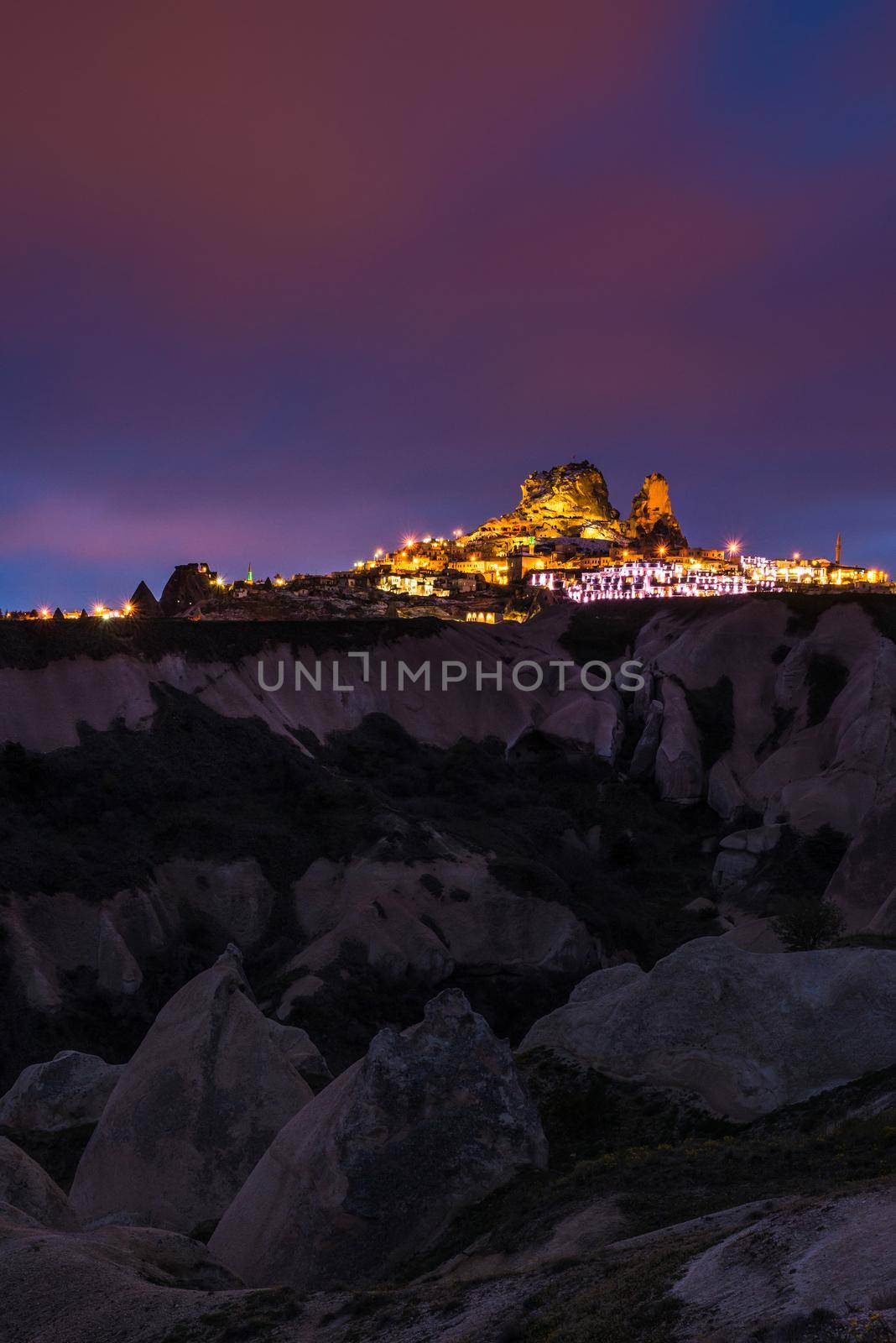Goreme ancient city and a castle of Uchisar from a mountains after twilight, Cappadocia in Central Anatolia, Turkey by Nuamfolio