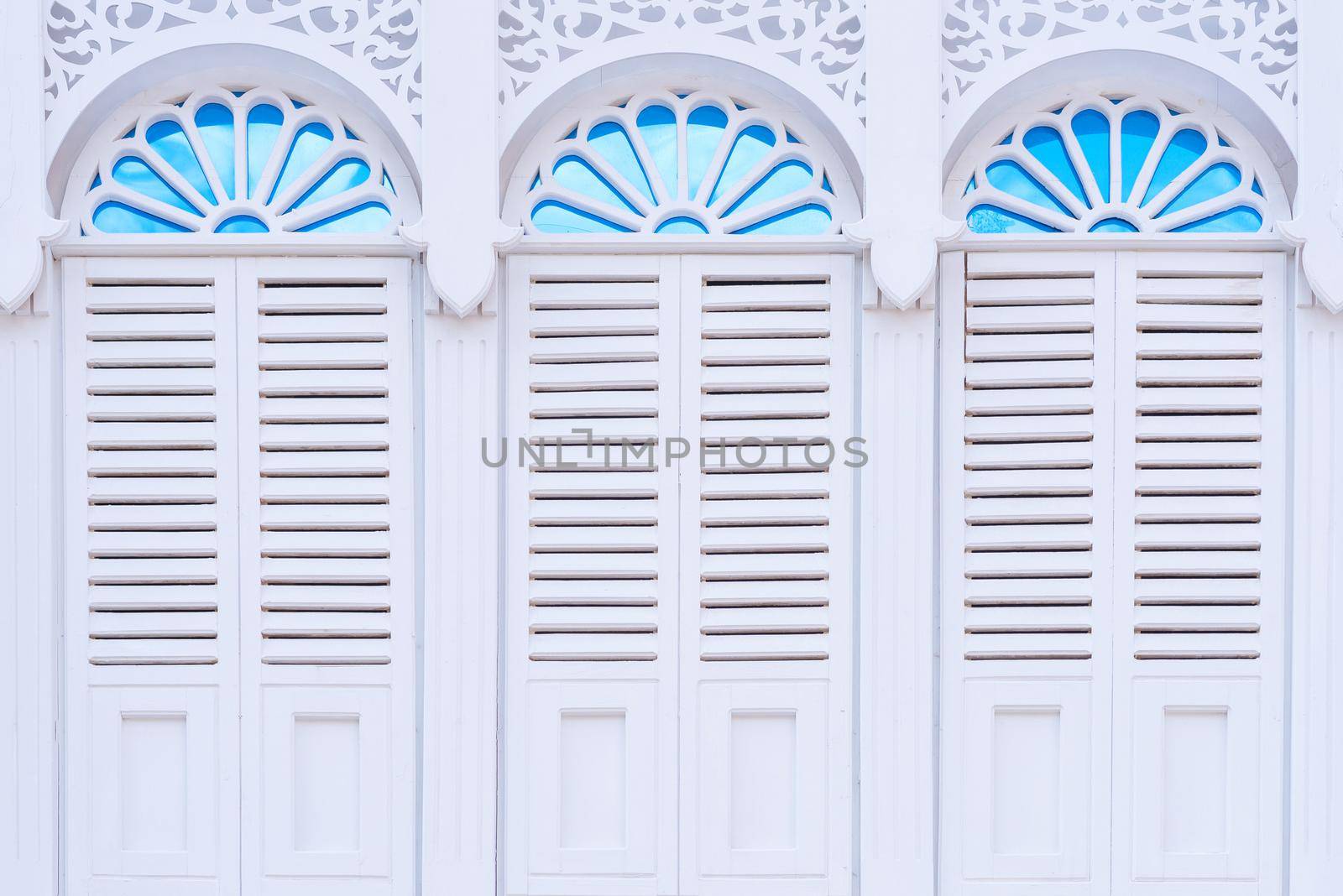 Beautiful architecture white windows with decorative frame of ancient classical building.
