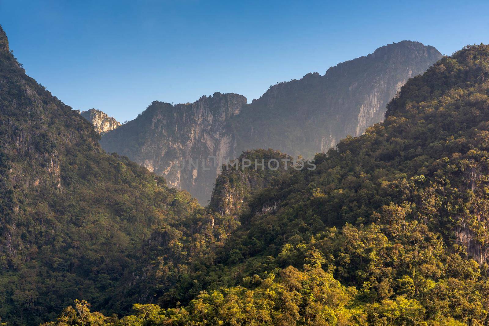Nature view of Doi Luang Chiang Dao mountain with blue sky,the famous mountain for tourist to visit in Chiang Mai,Thailand. by Nuamfolio