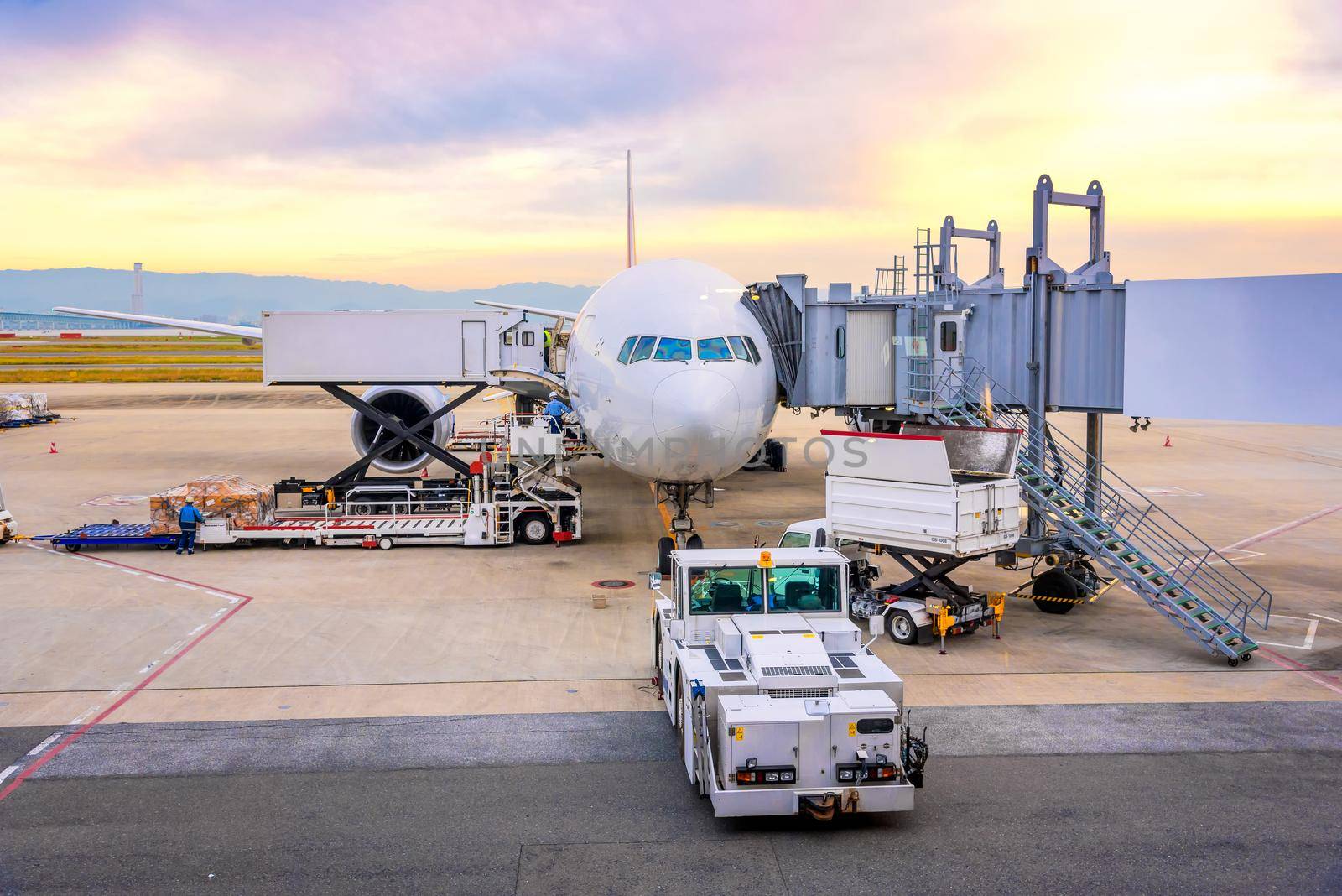 Airport ramp service for for a commercial plane landing at Narita International Airport in Tokyo,Japan. by Nuamfolio