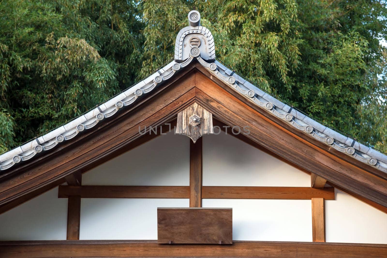 Close up of Japanese tradition roof and wood structure of ancient building in Kyoto, Japan. by Nuamfolio