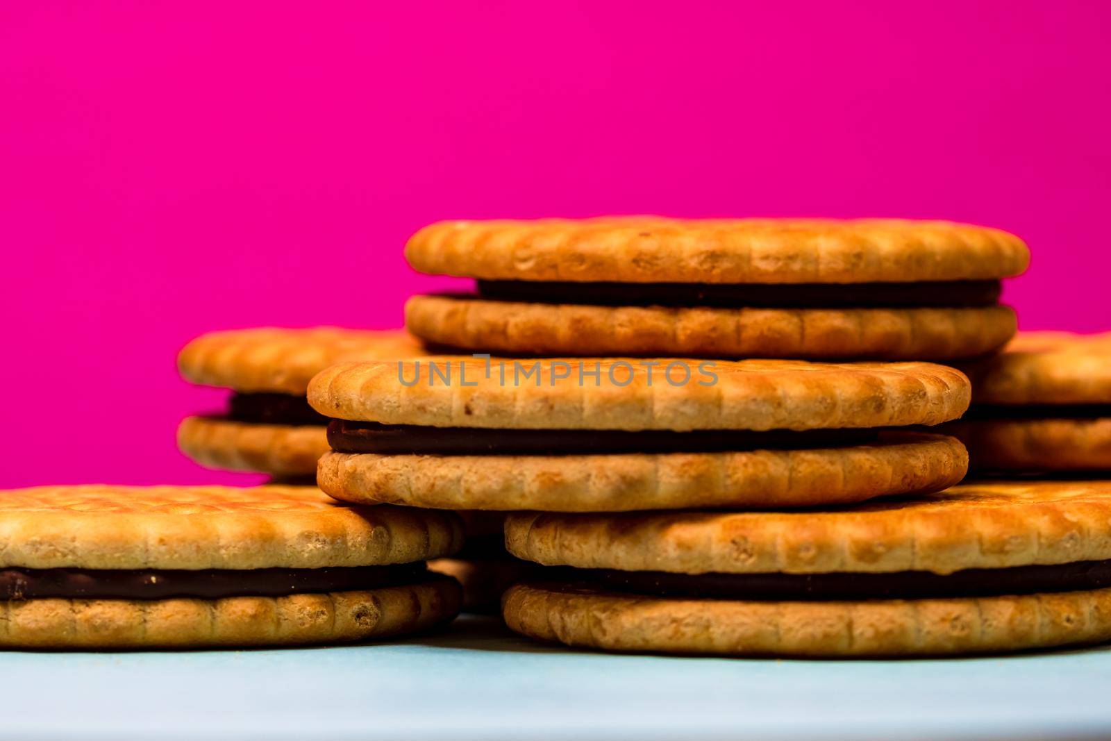 Round biscuits with chocolate cream, sandwich biscuits with chocolate filling isolated.