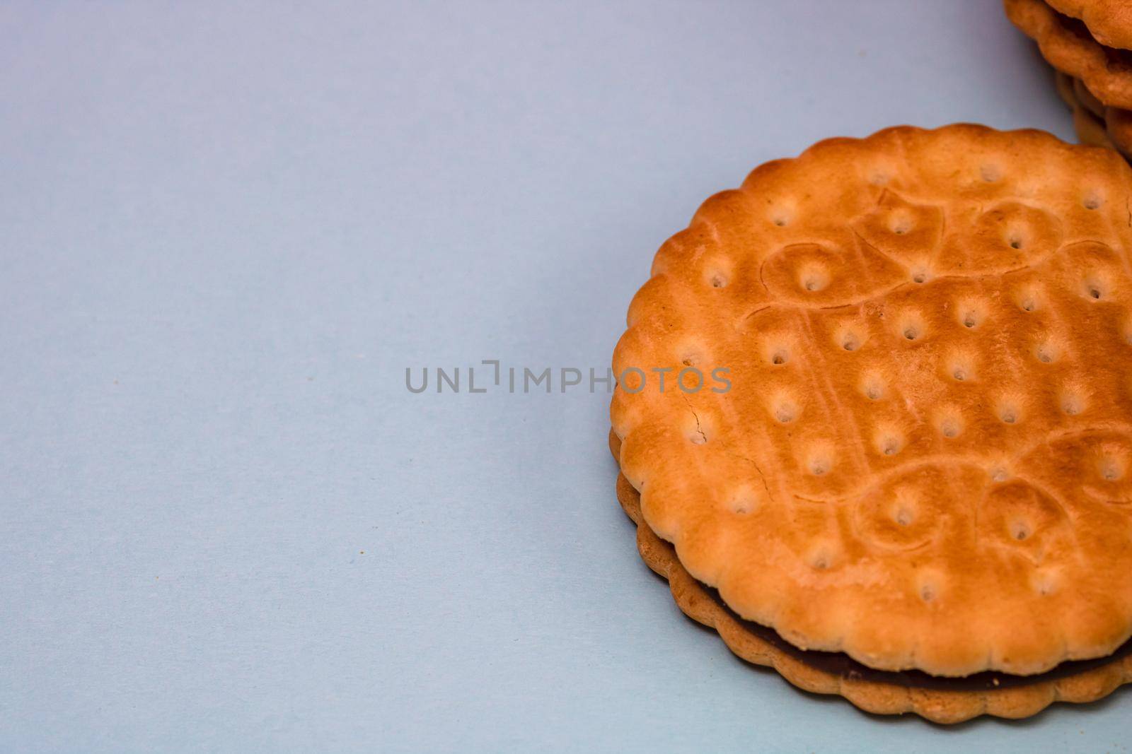 Round biscuits with chocolate cream, sandwich biscuits with chocolate filling isolated. by vladispas