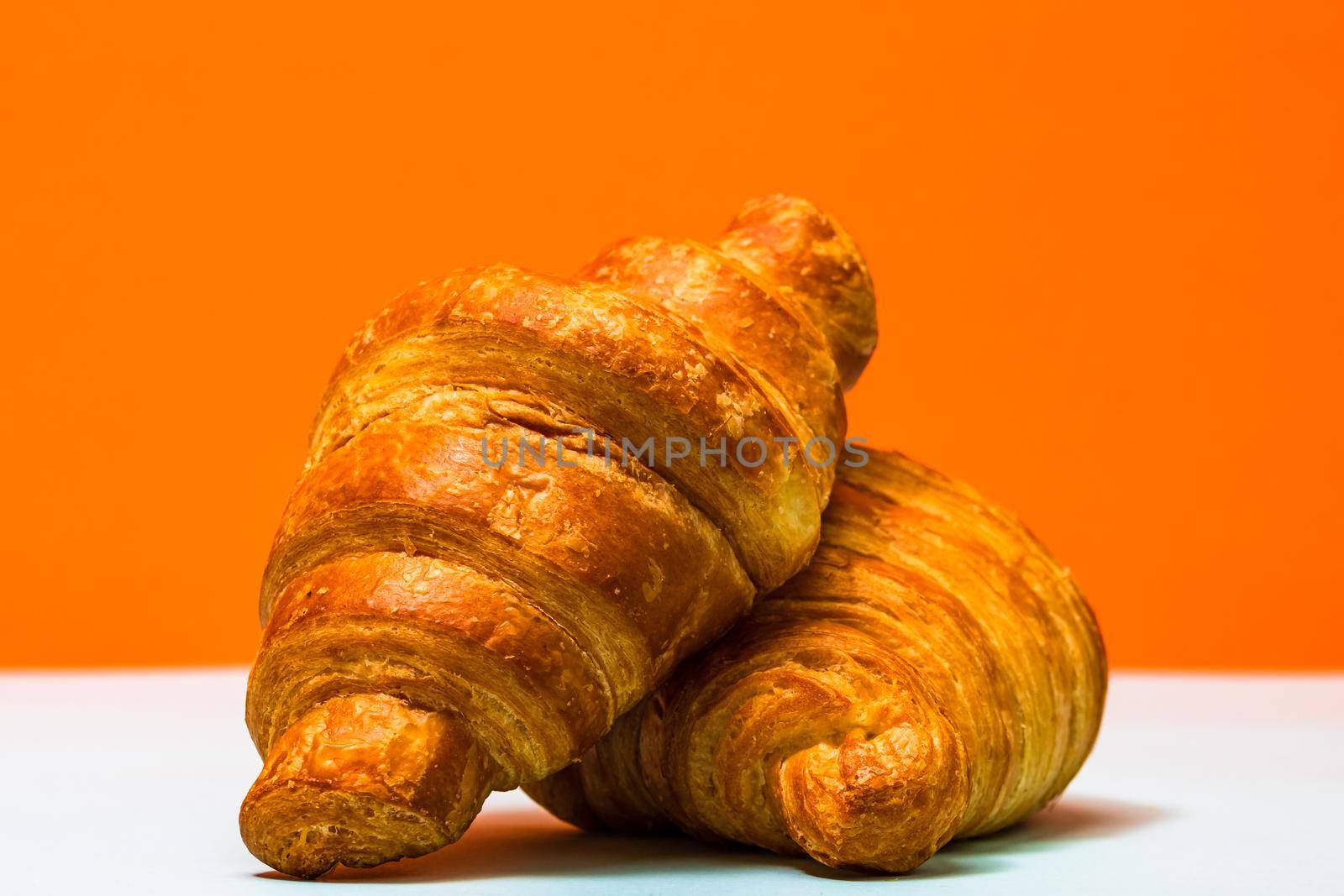 Fresh and delicious croissants isolated. French breakfast concept.