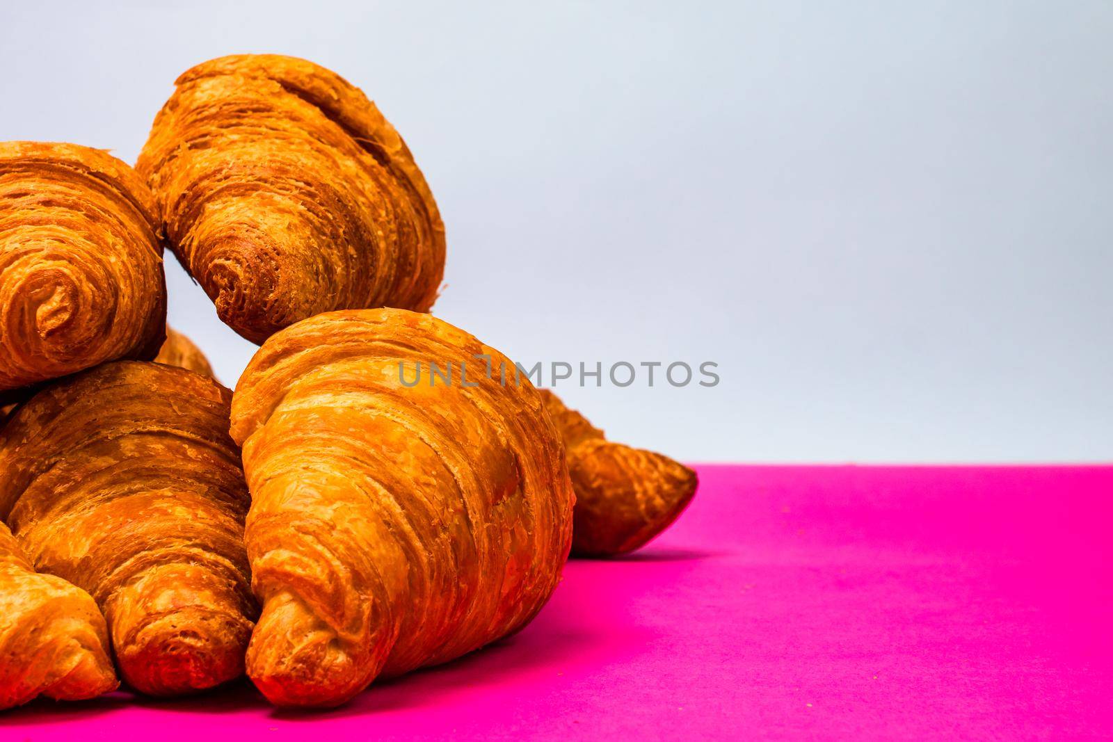 Fresh and delicious croissants isolated. French breakfast concept. by vladispas