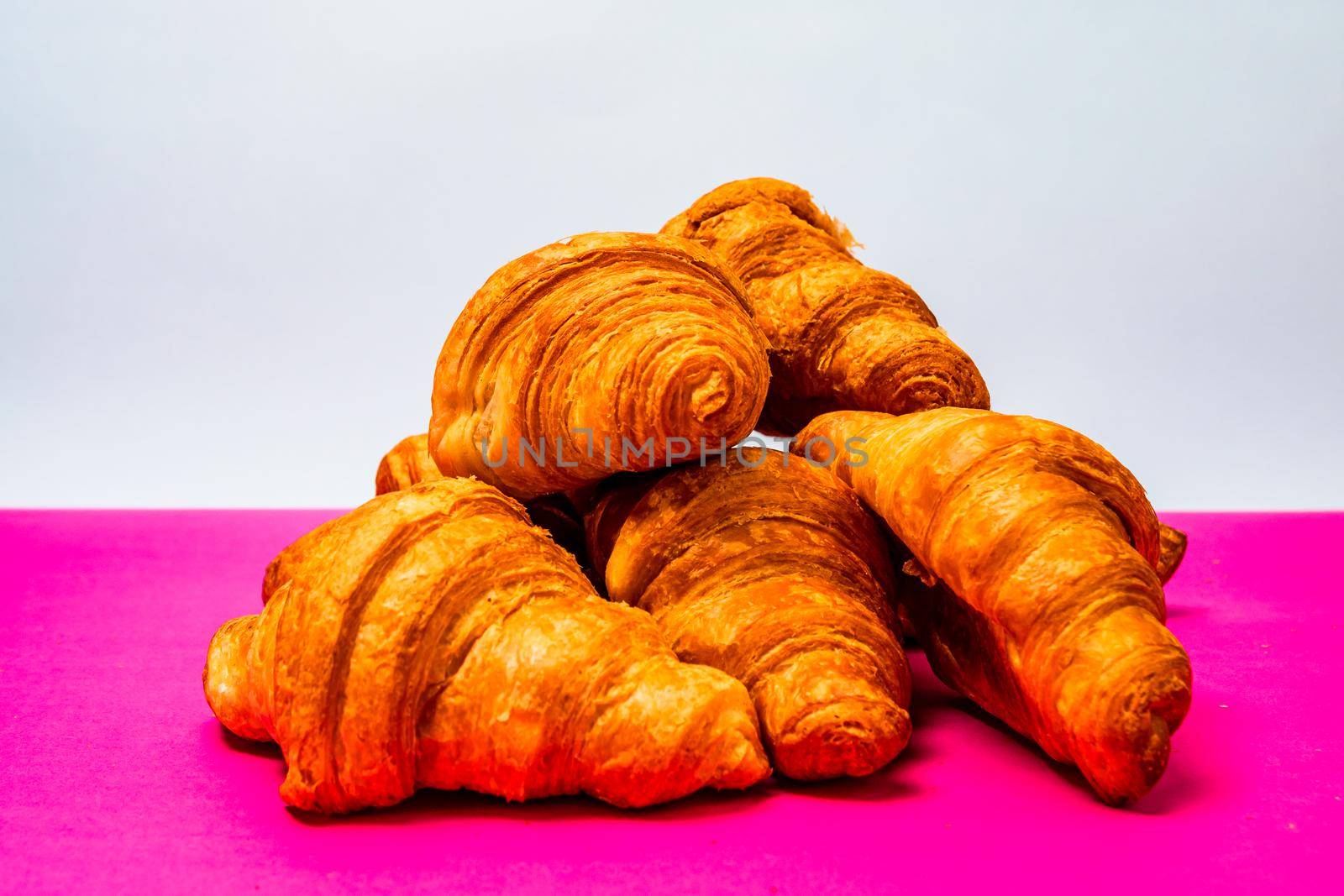 Fresh and delicious croissants isolated. French breakfast concept.