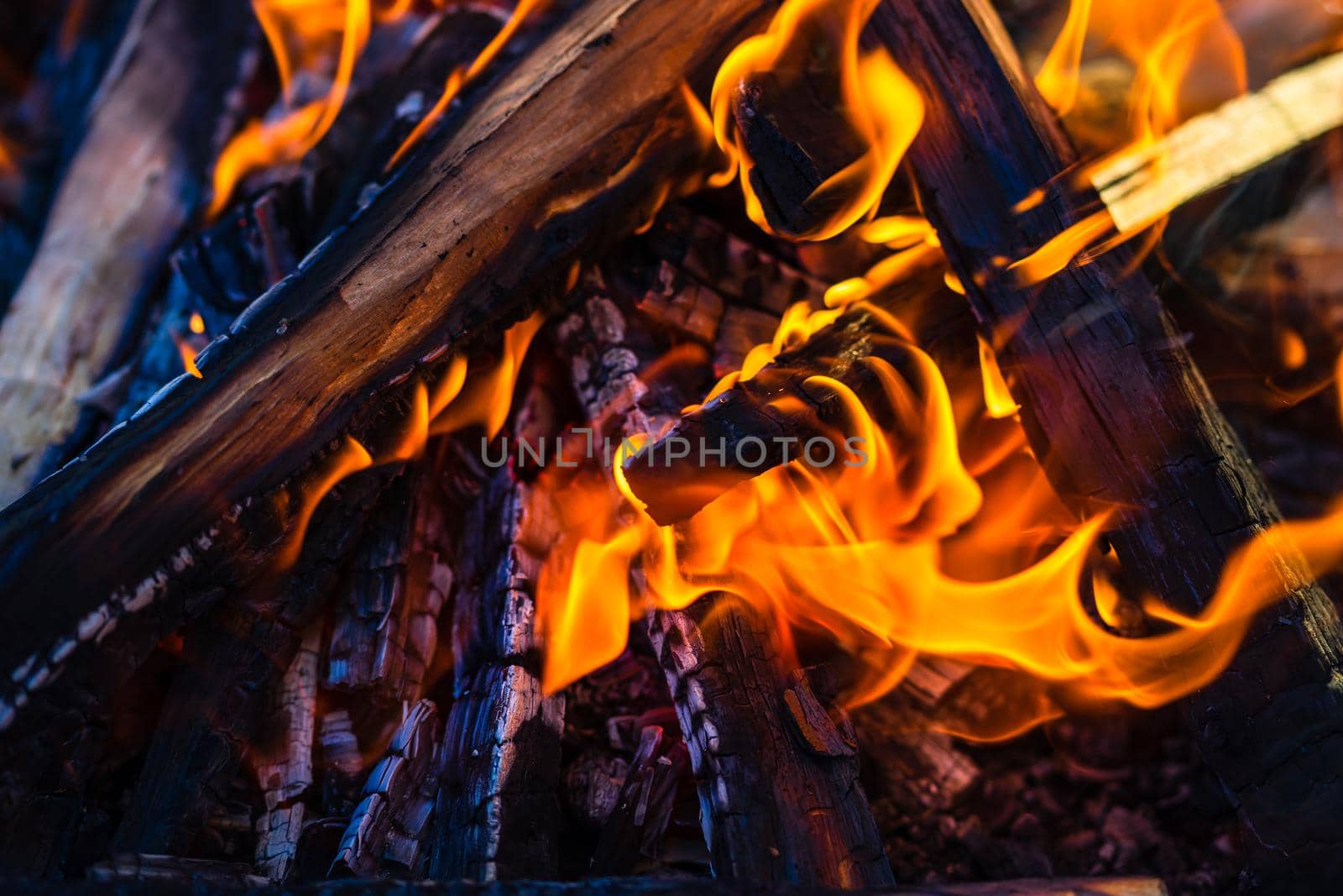 Burning wood chips to form coal. Barbecue preparation, fire before cooking.