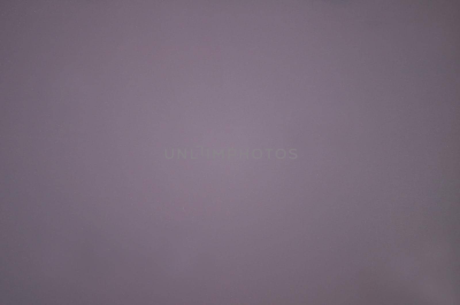 The rough surface of the paper is lilac-colored.Texture or background