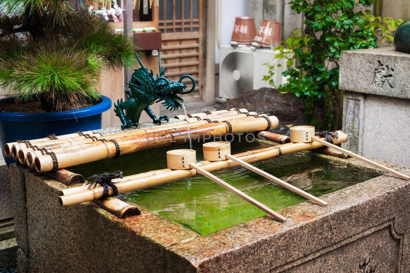 Water ablutions pavilion for a ceremonial purification at the Nishiki Tenmangu Shrine, Kyoto. Japan by zhu_zhu