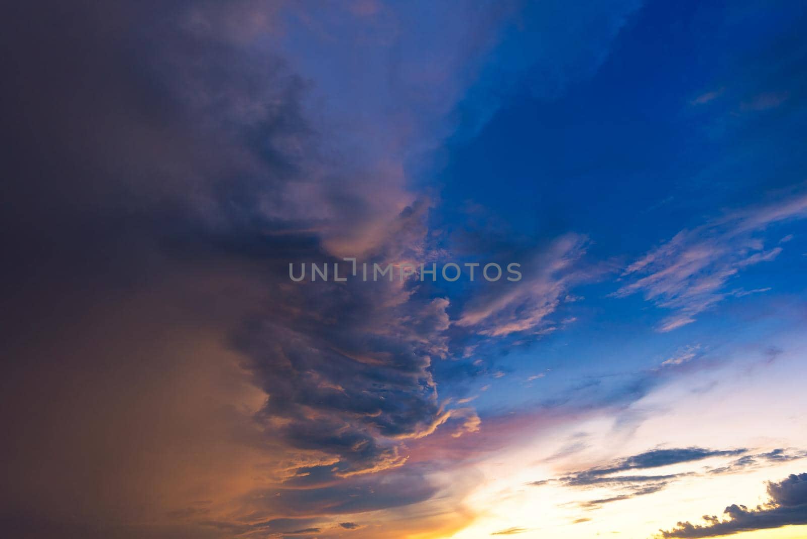 Dramatic sky with storm cloud before raining during sunset. by Nuamfolio