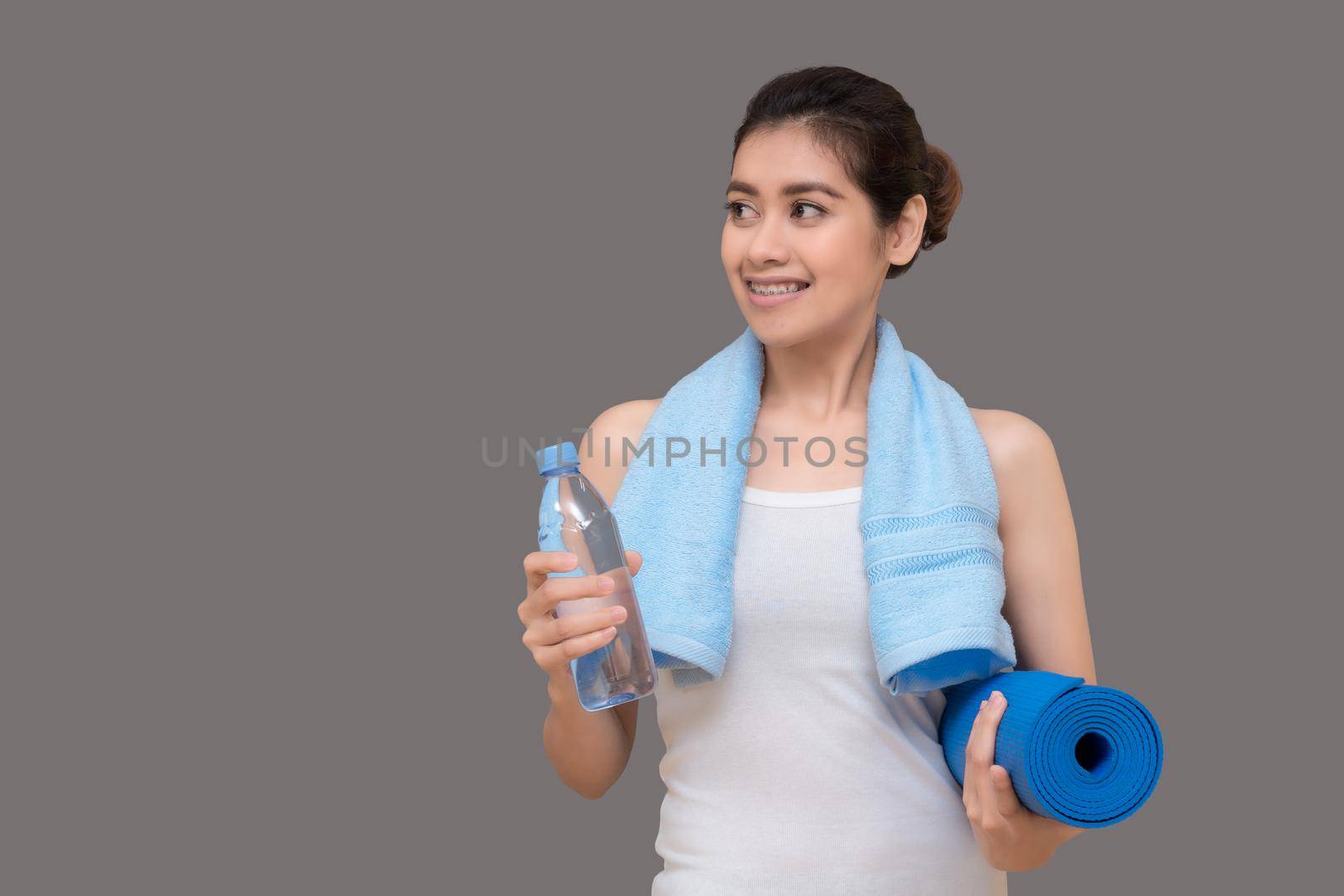 Healthy woman ready to exercise at sport gym, girl doing sport indoor.Photo design for fitness sporty woman and healthcare concept. by Nuamfolio