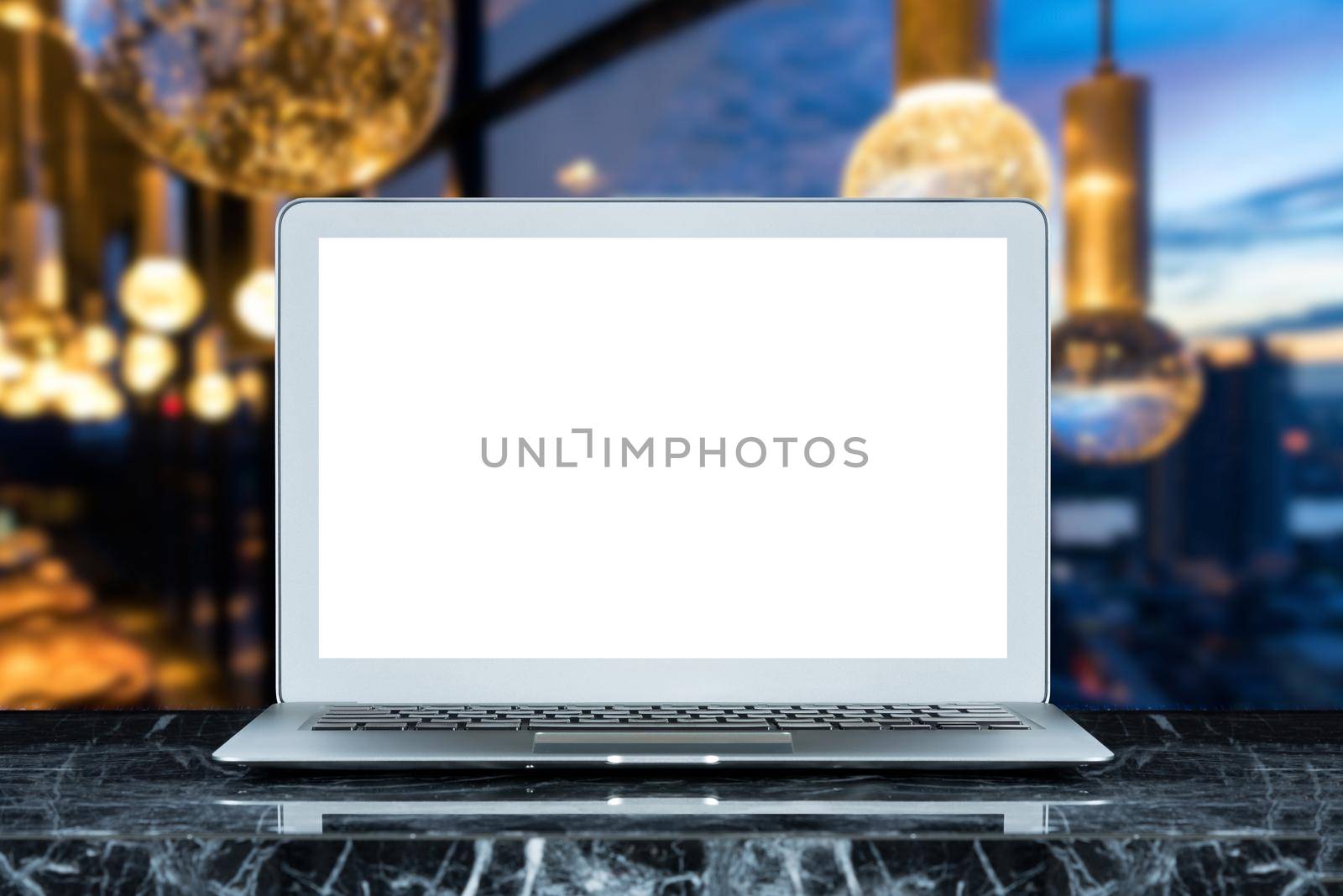 Smart modern laptop with white blank screen on marble table and sky lounge background. Elegant Design with copy space for placement your template mock up. by Nuamfolio